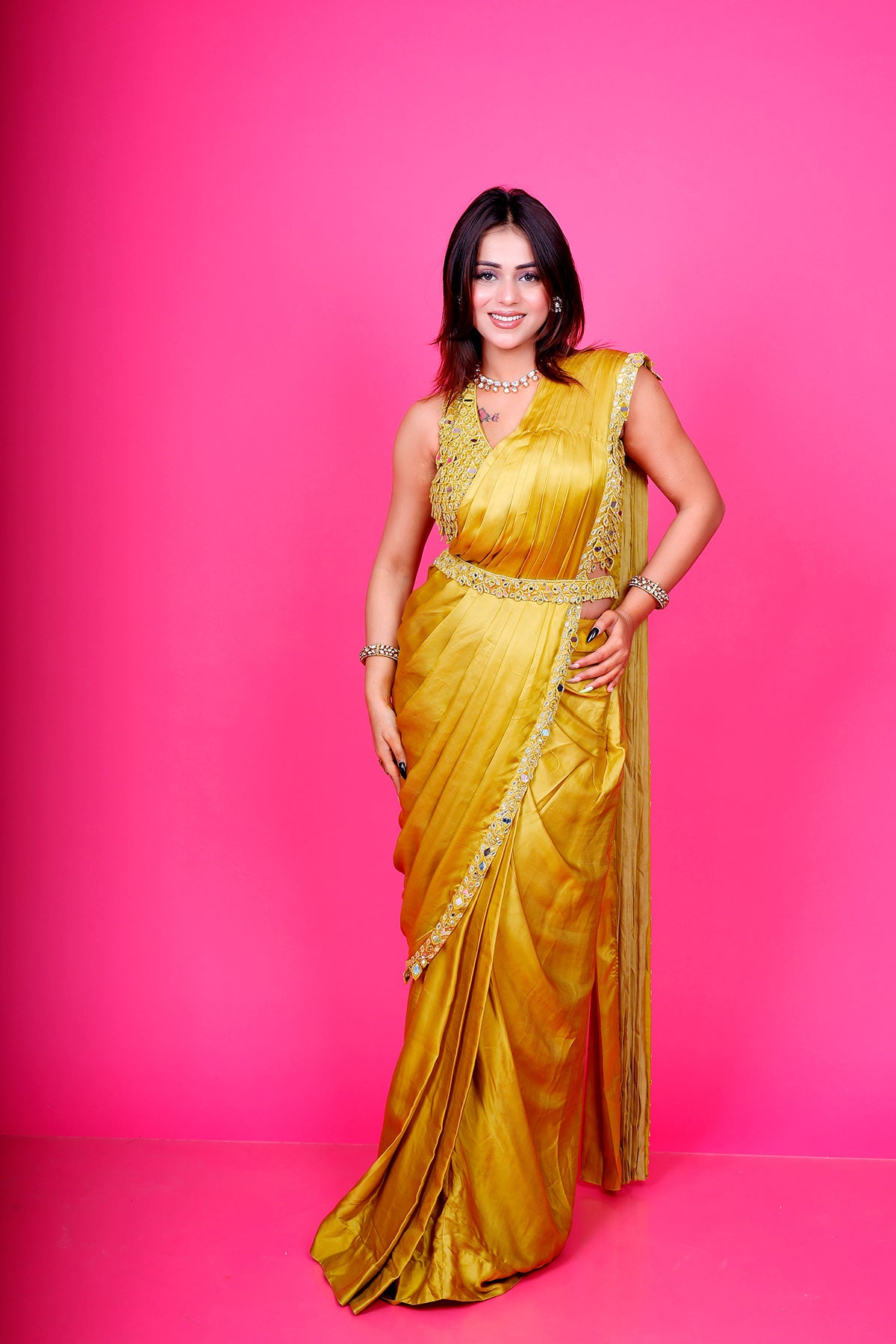 Yellow Drape saree with mirror and pearl work blouse along with waist belt