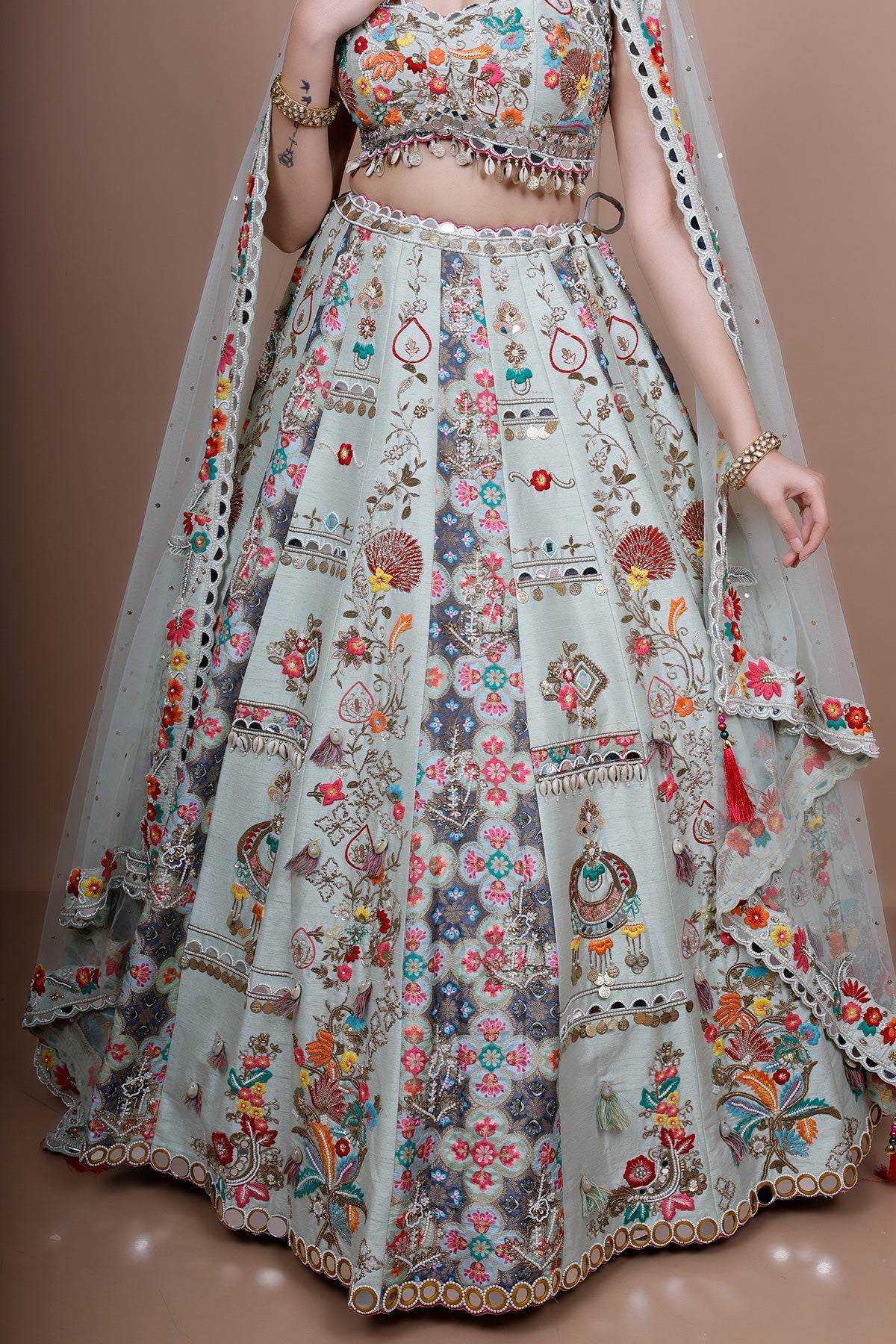 Pista Lehenga Choli in Silk embellished with heavy embroidery
