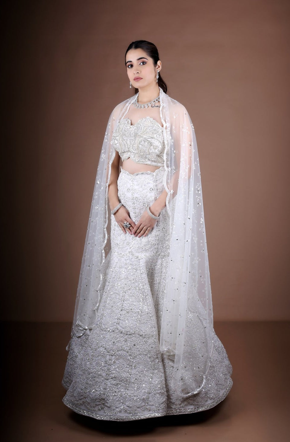 Off White Fish-Cut Lehenga with off shoulder Blouse