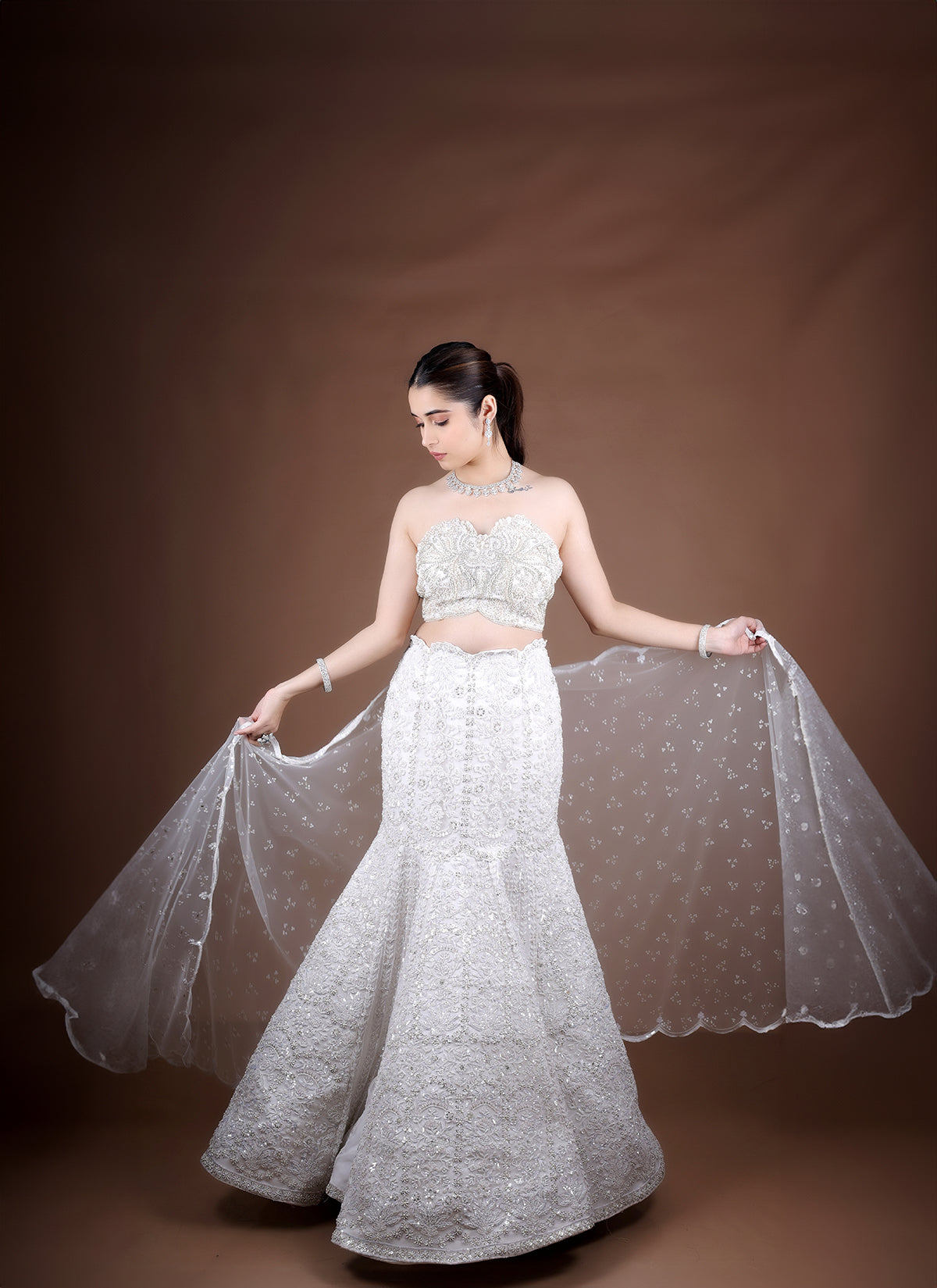 Off White Fish-Cut Lehenga with off shoulder Blouse