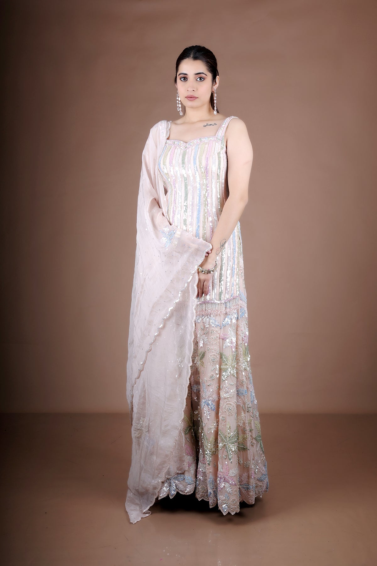 Pink Sharara suit adorned with hand embroidery