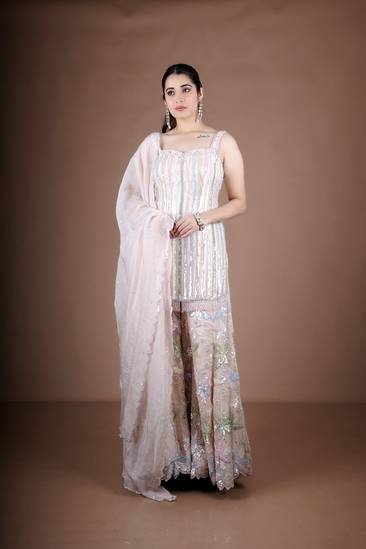 Pink Sharara suit adorned with hand embroidery