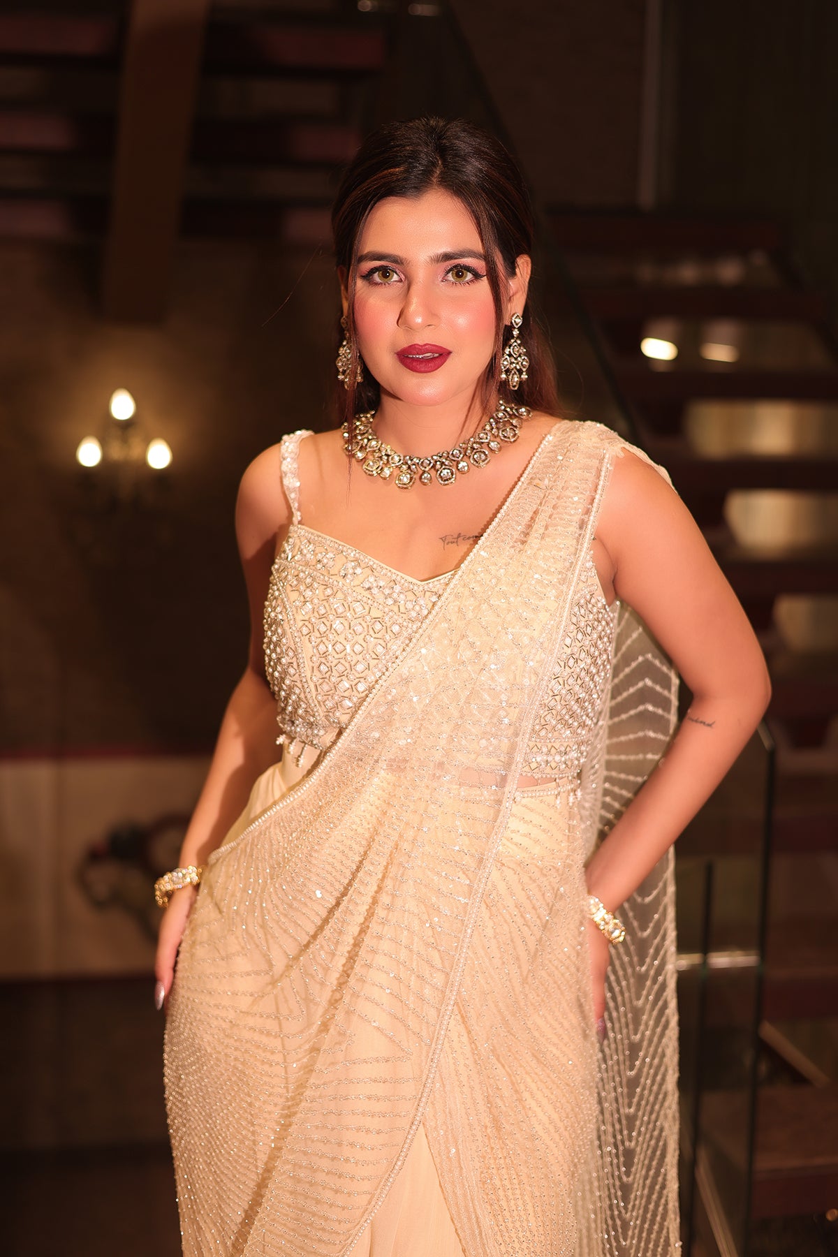 White Draped Saree in Net adorned with heavy hand embroidery