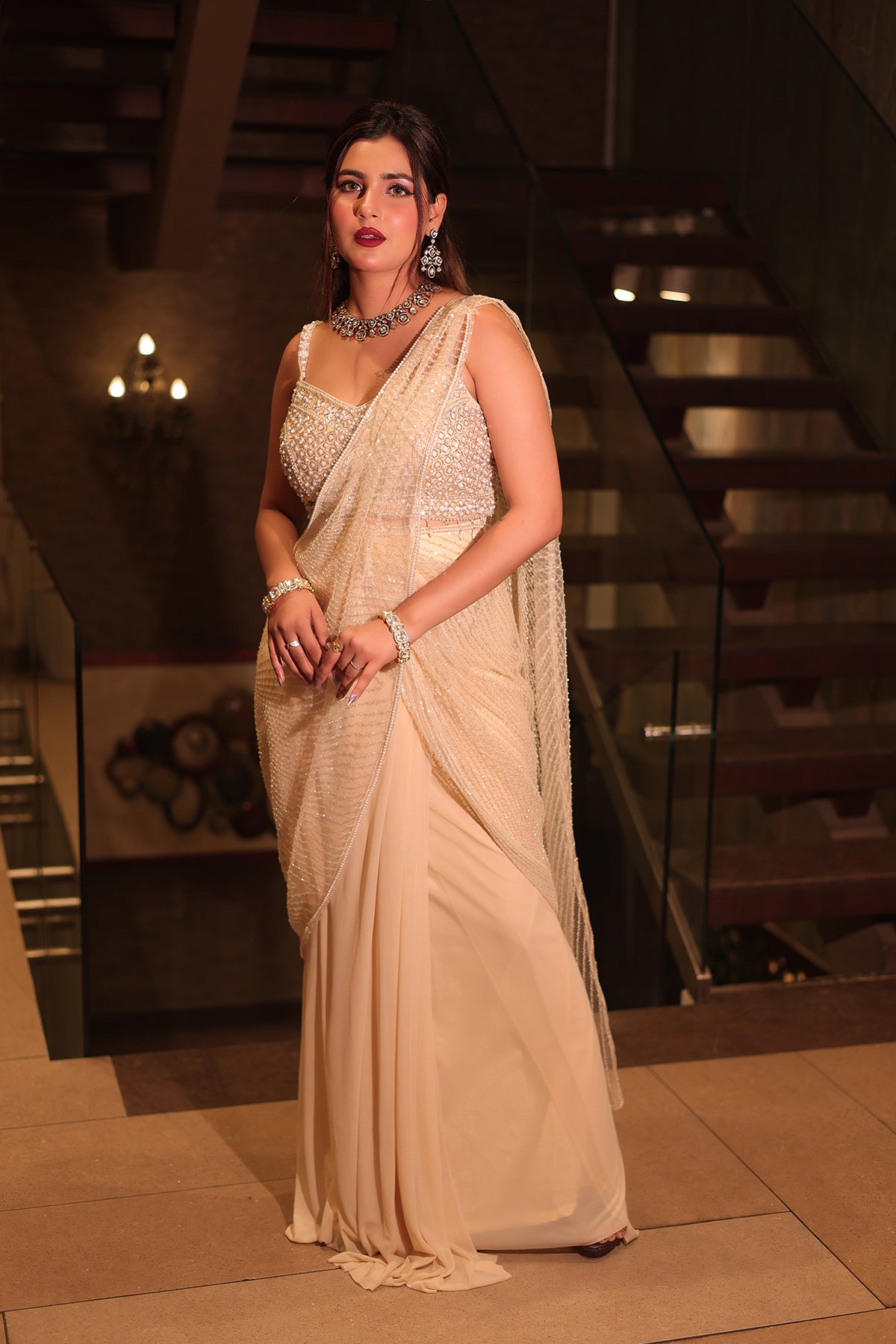 White Draped Saree in Net adorned with heavy hand embroidery