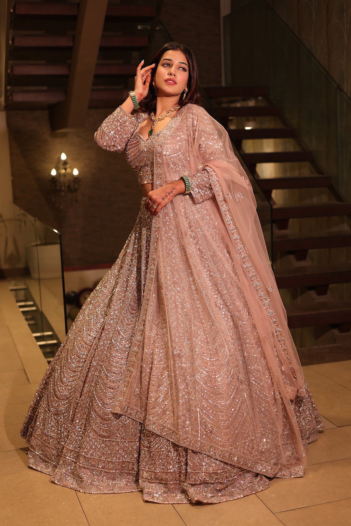 Rose Gold Lehenga Choli adorned with hand embroidery