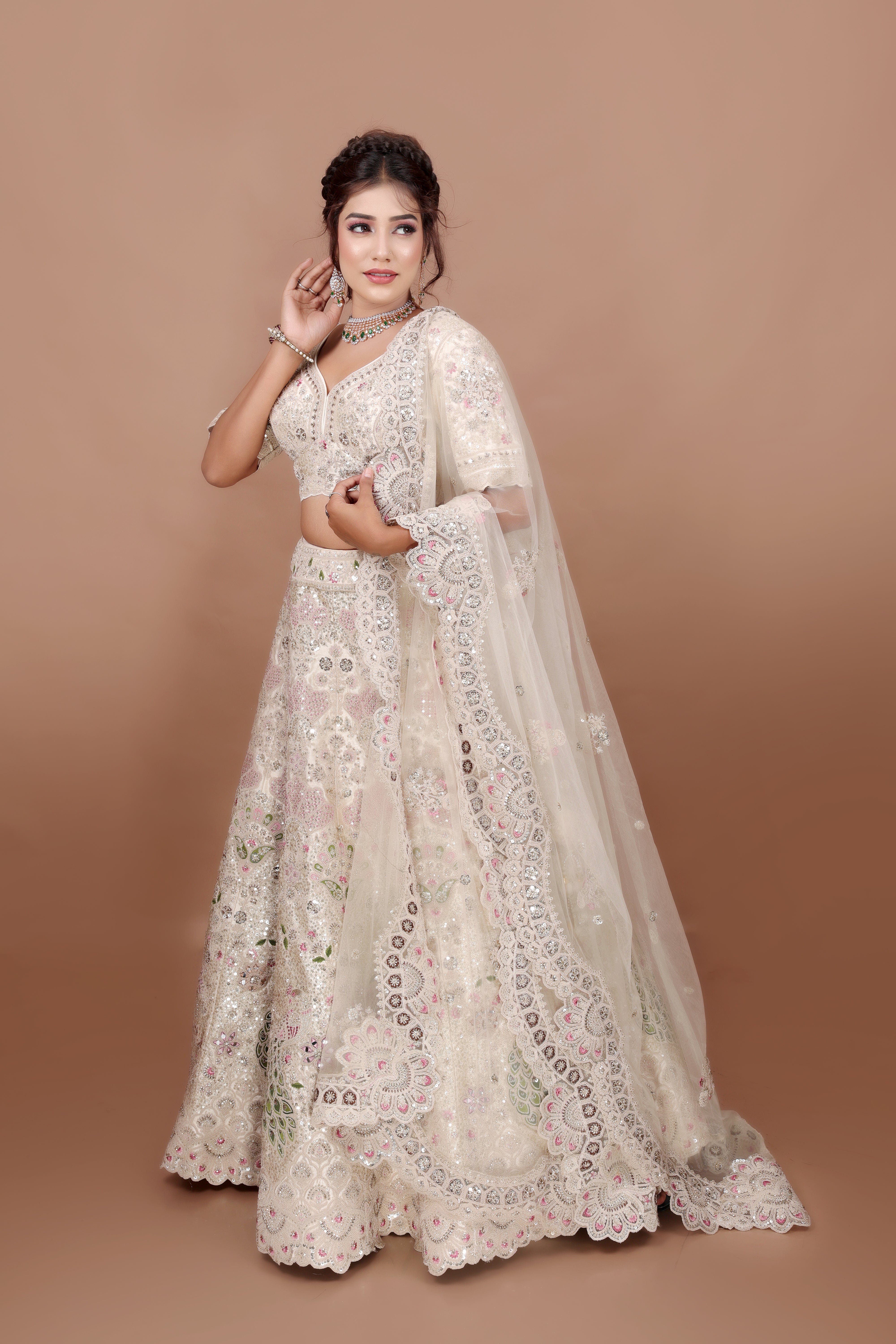 White Lehenga in Silk fabric adorned with thread, pearl and cut dana embroidery