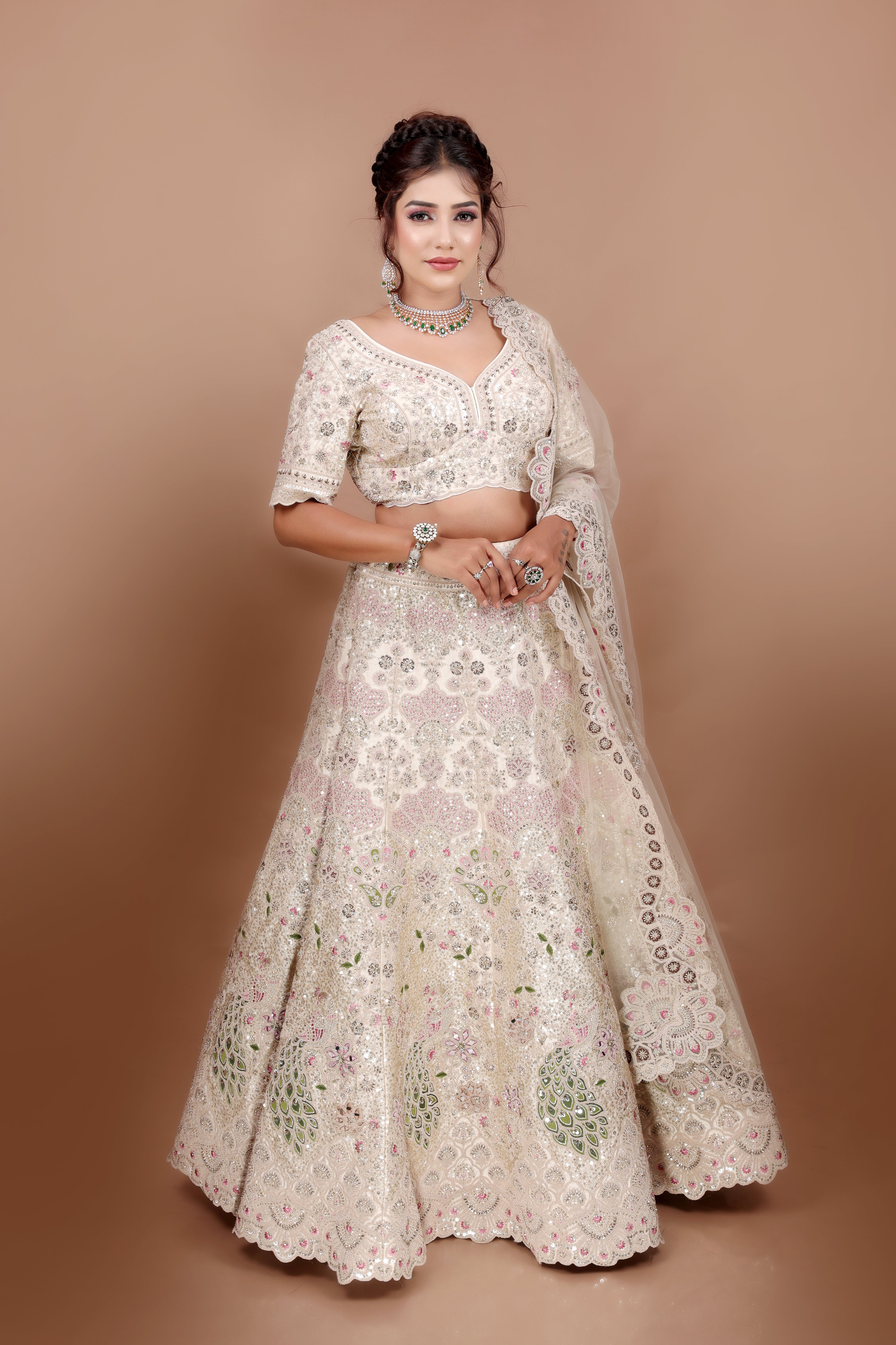 White Lehenga in Silk fabric adorned with thread, pearl and cut dana embroidery