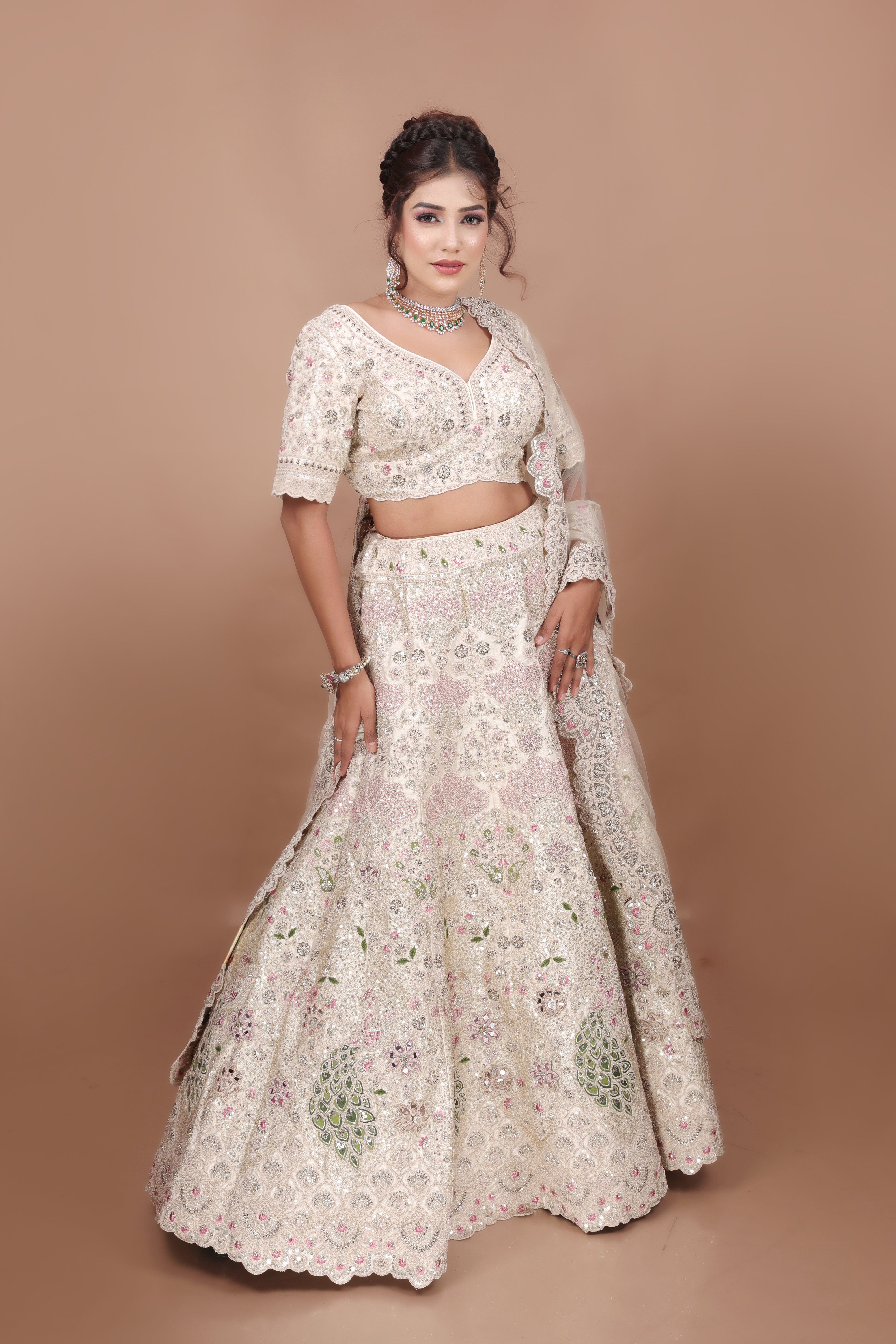 White Lehenga in Silk fabric adorned with thread, pearl and cut dana embroidery