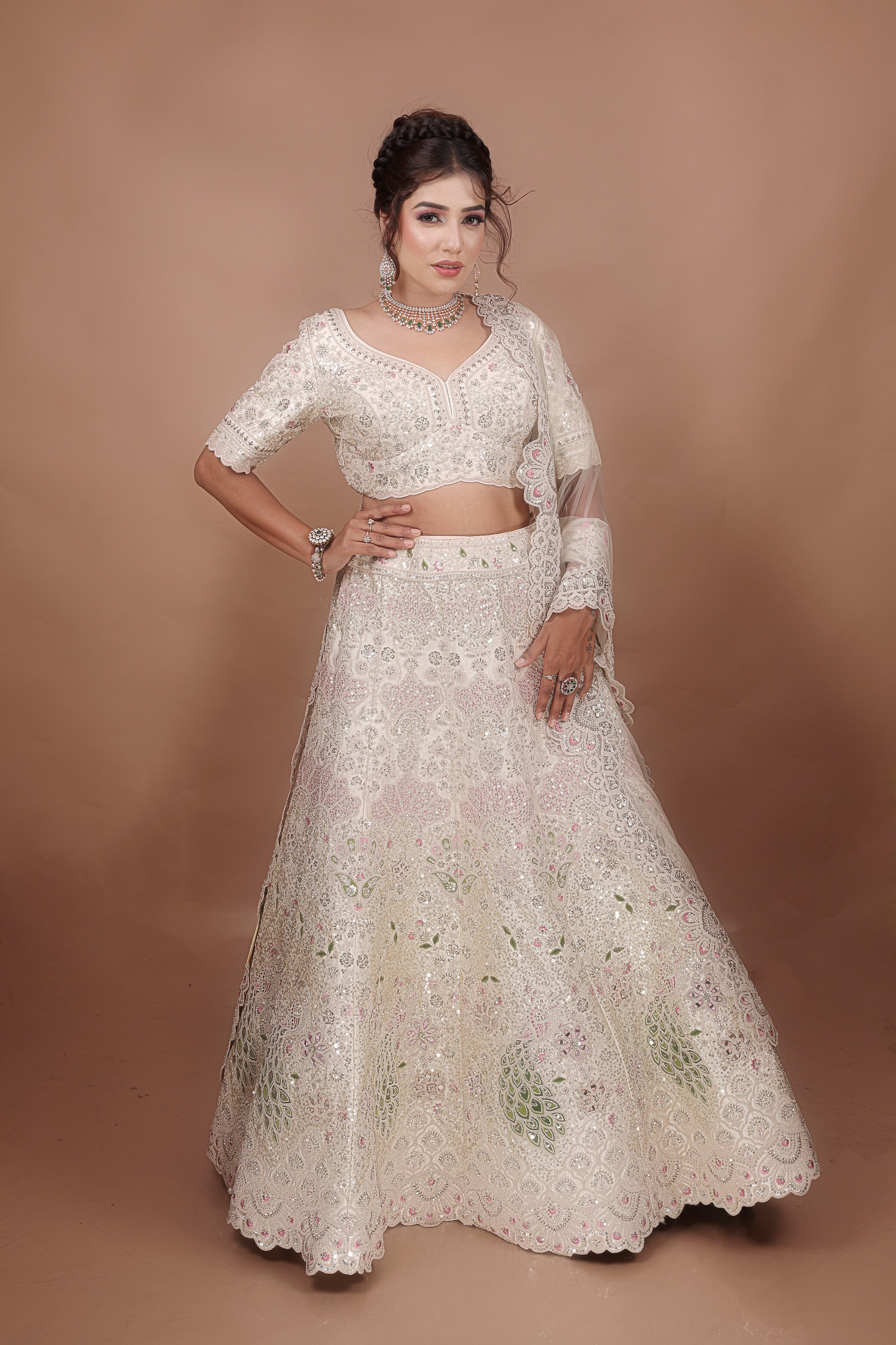 White Lehenga in Silk fabric adorned with thread, pearl and cut dana embroidery