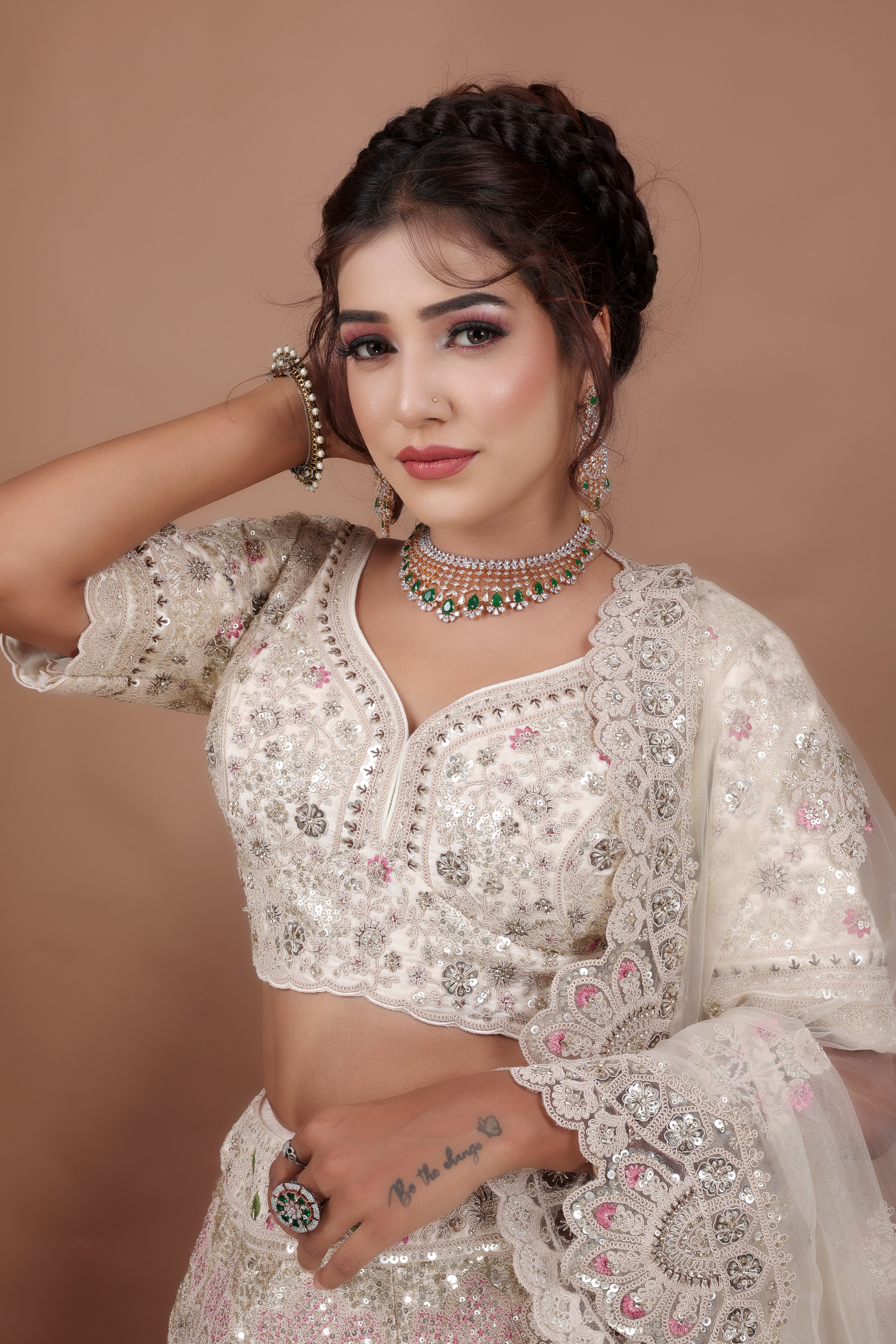 White Lehenga in Silk fabric adorned with thread, pearl and cut dana embroidery