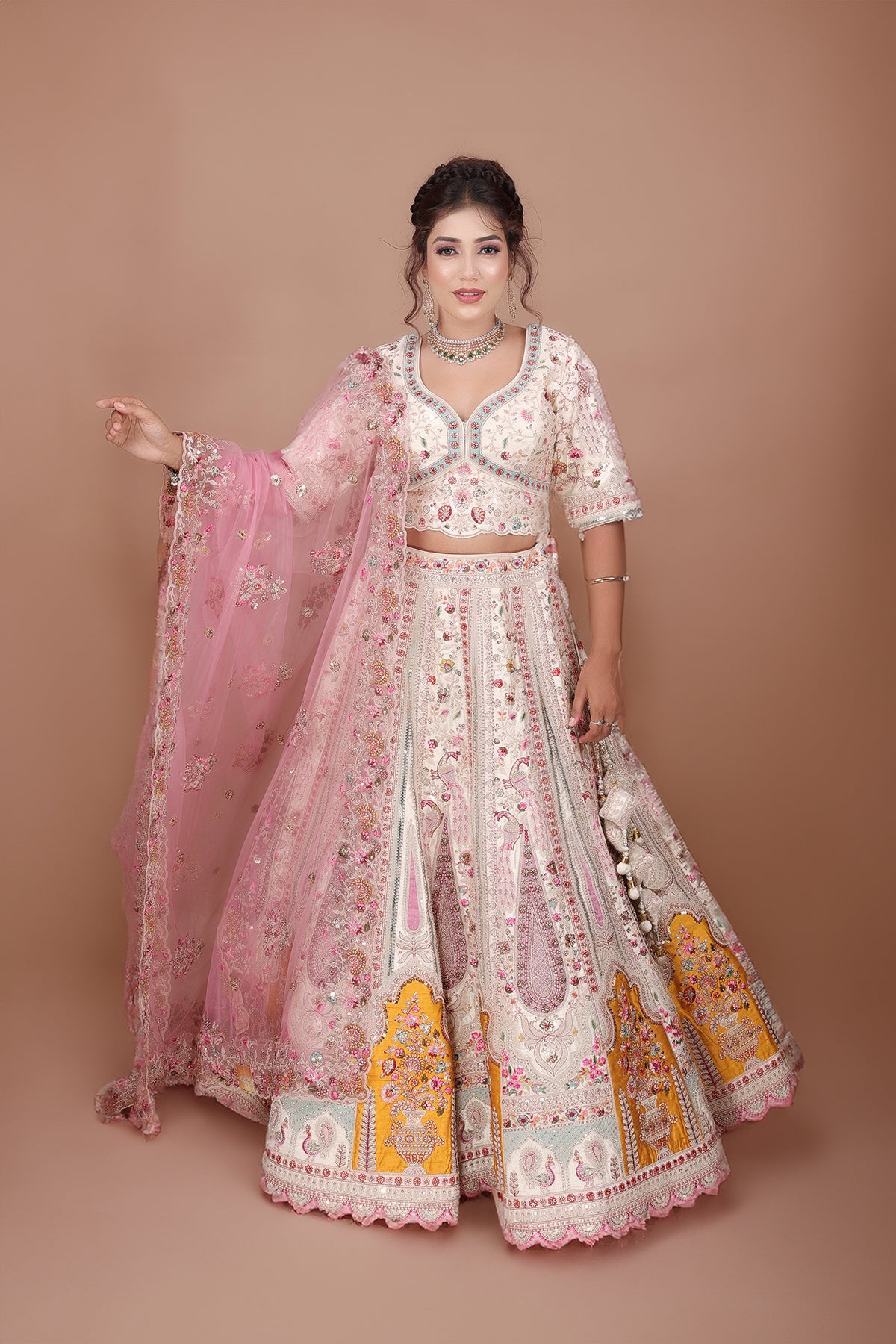 White Lehenga adorned with intricate embroidery and beads, making it an elegant and eye-catching piece