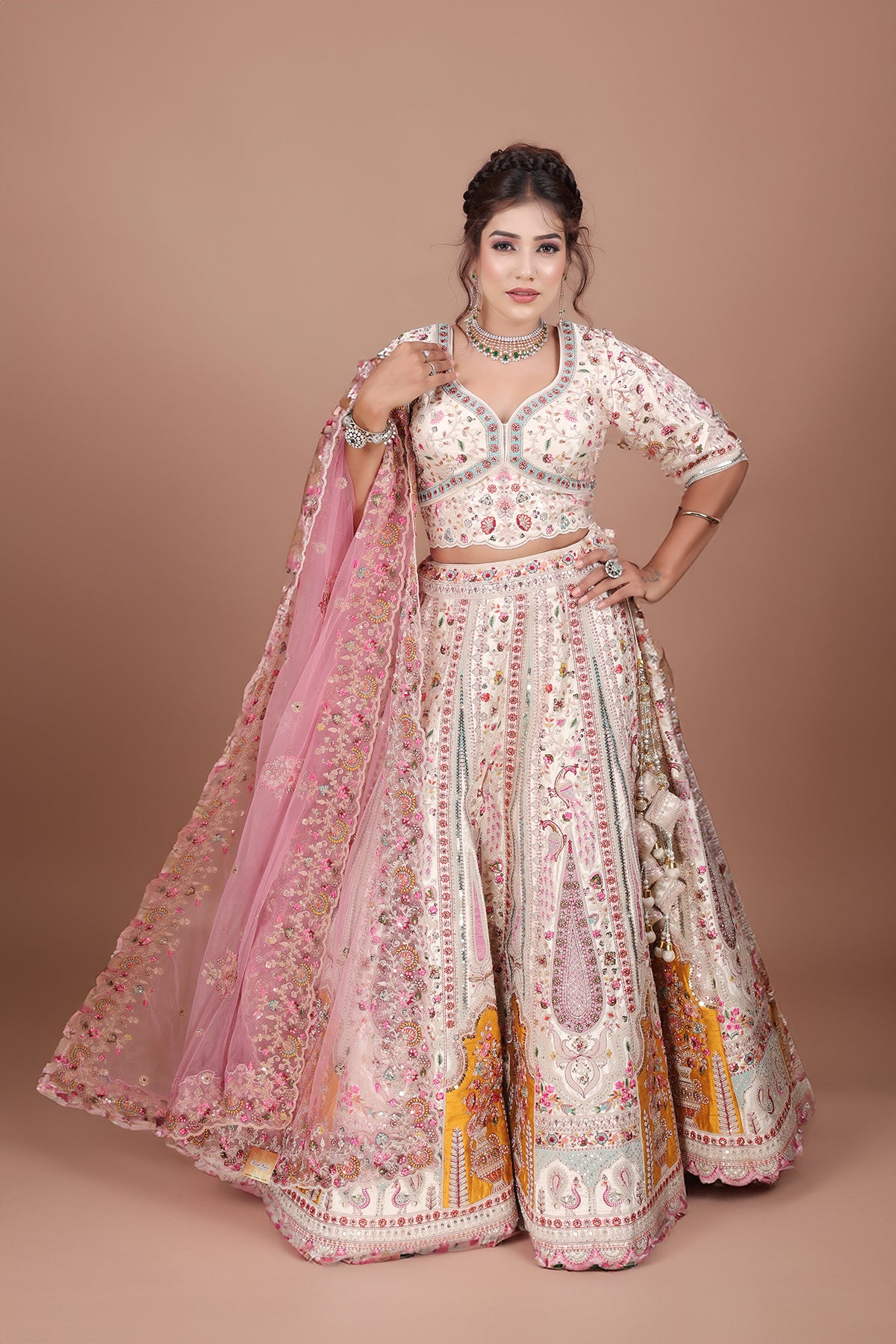 White Lehenga adorned with intricate embroidery and beads, making it an elegant and eye-catching piece