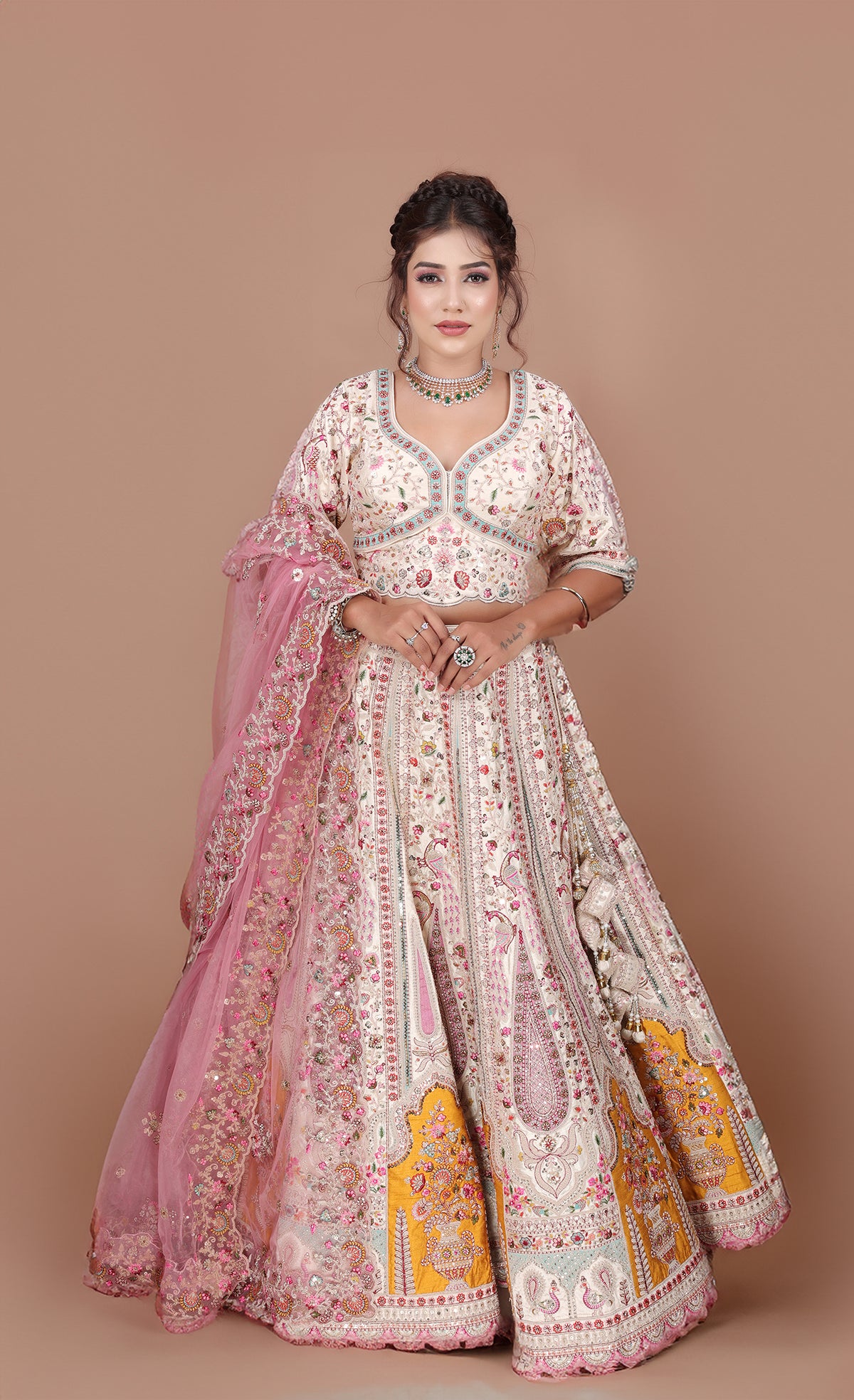 White Lehenga adorned with intricate embroidery and beads, making it an elegant and eye-catching piece