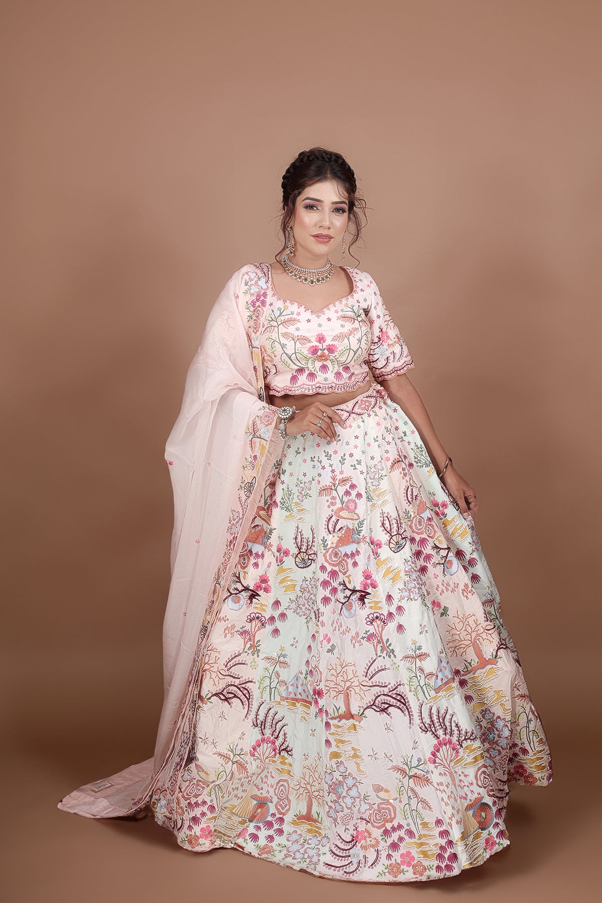 White and Pink Lehenga adorned with intricate embroidery and beads, making it an elegant and eye-catching piece