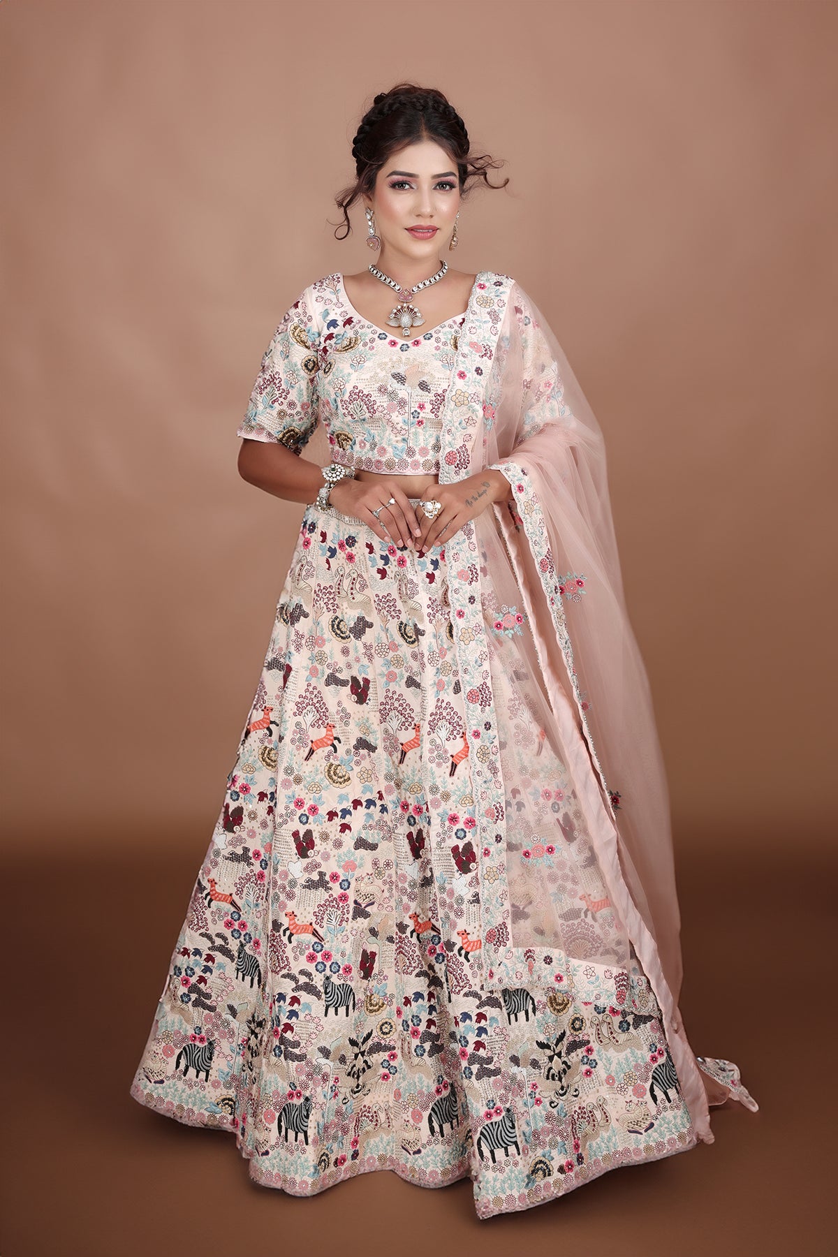 White and Pink Lehenga adorned with intricate embroidery and beads, making it an elegant and eye-catching piece