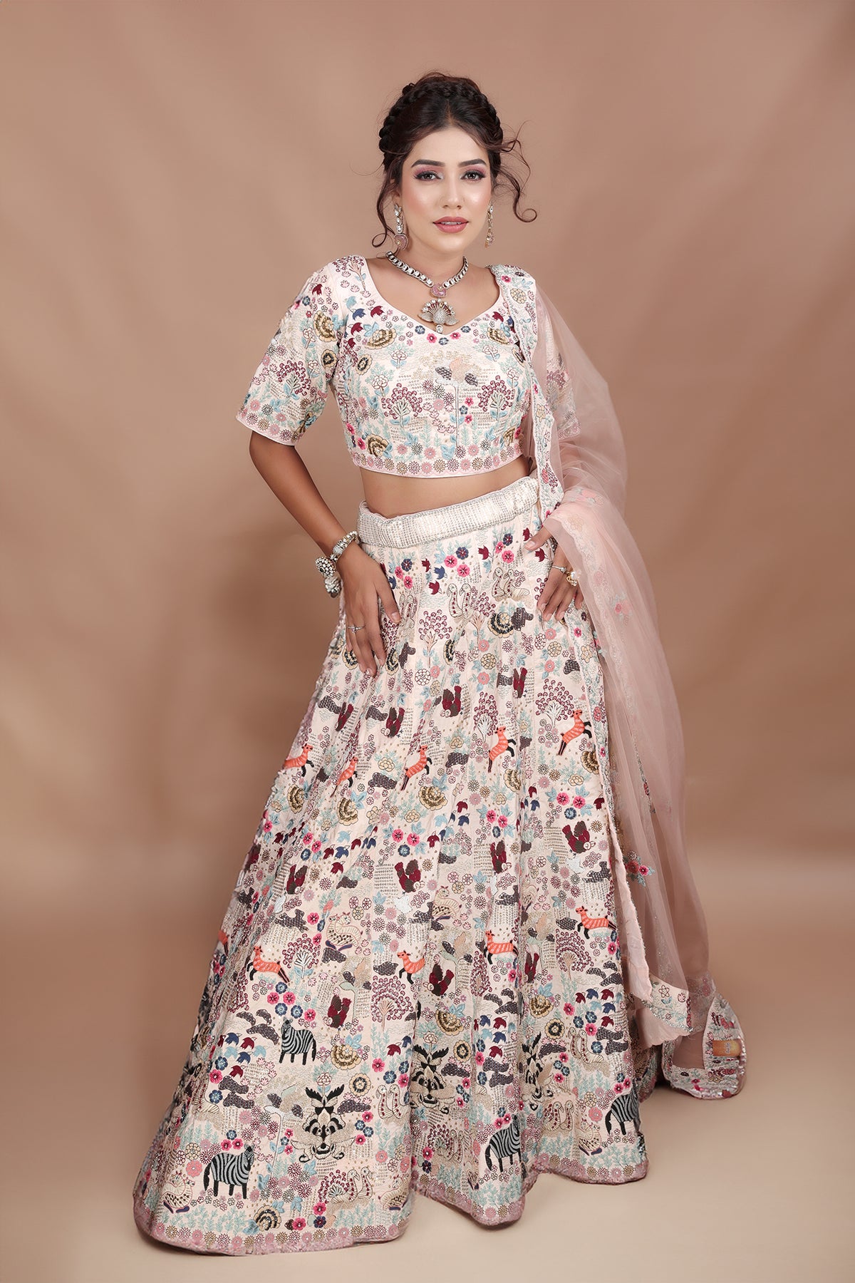 White and Pink Lehenga adorned with intricate embroidery and beads, making it an elegant and eye-catching piece