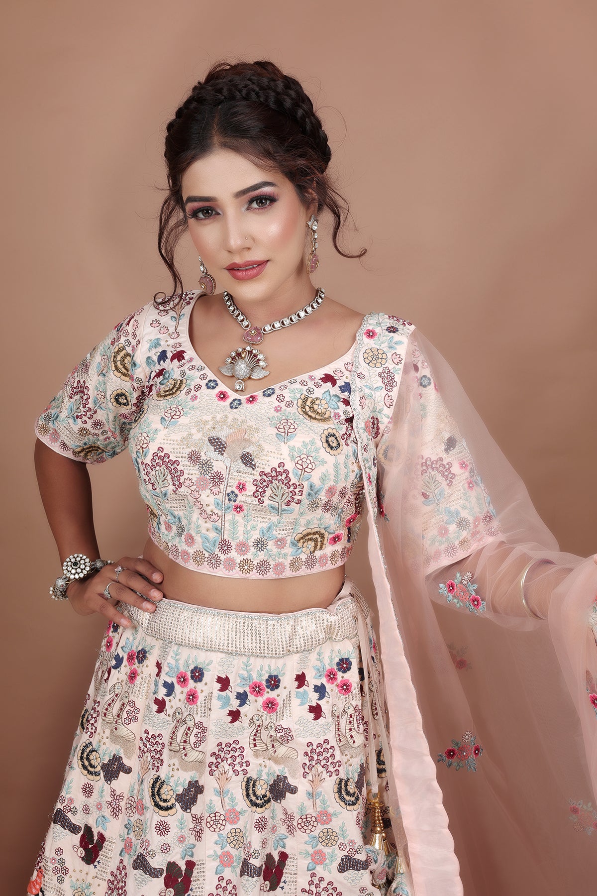 White and Pink Lehenga adorned with intricate embroidery and beads, making it an elegant and eye-catching piece