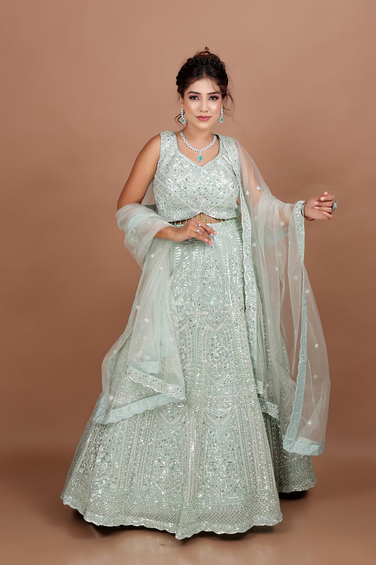 Sea Green Lehenga in Net fabric adorned with thread, pearl and cut dana embroidery