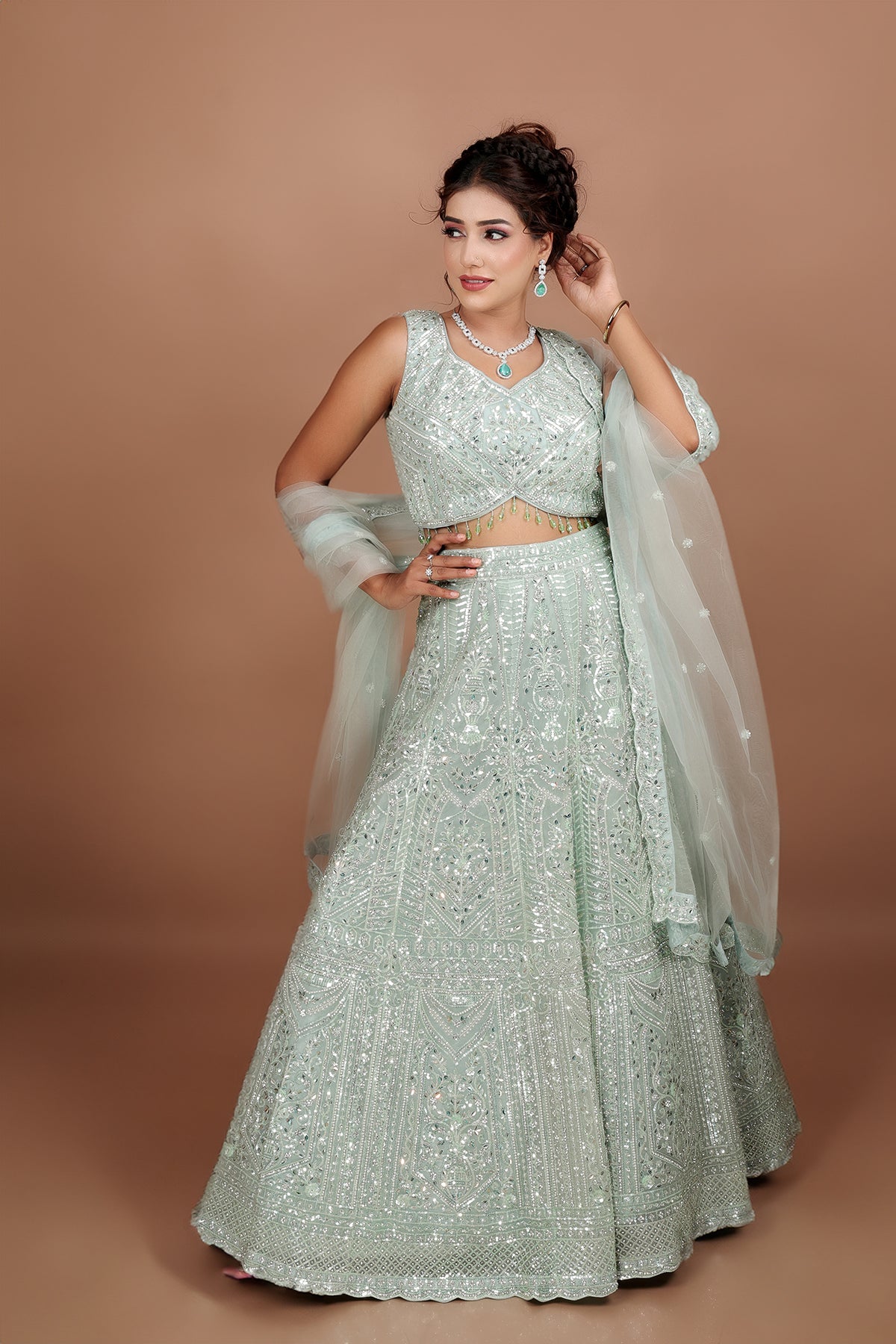 Sea Green Lehenga in Net fabric adorned with thread, pearl and cut dana embroidery