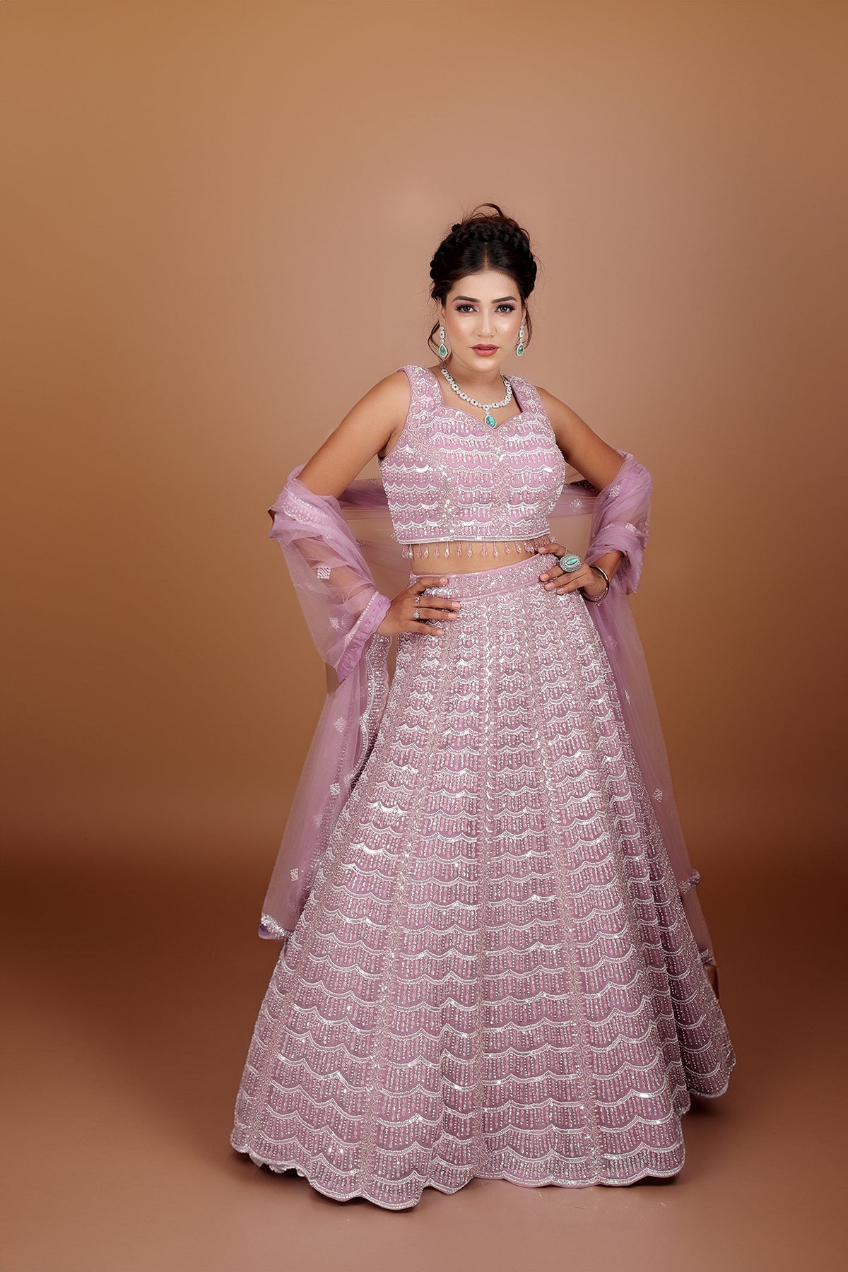 Mauve Lehenga in Net fabric adorned with thread, pearl and cut dana embroidery