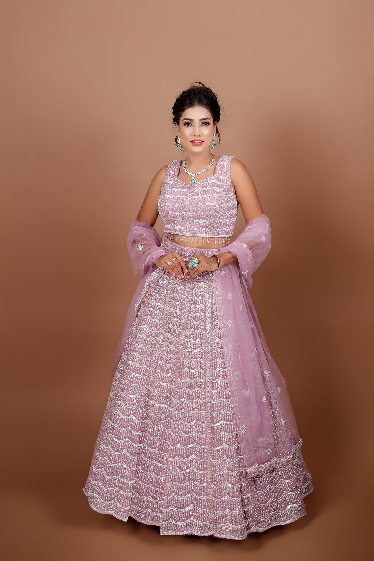 Mauve Lehenga in Net fabric adorned with thread, pearl and cut dana embroidery