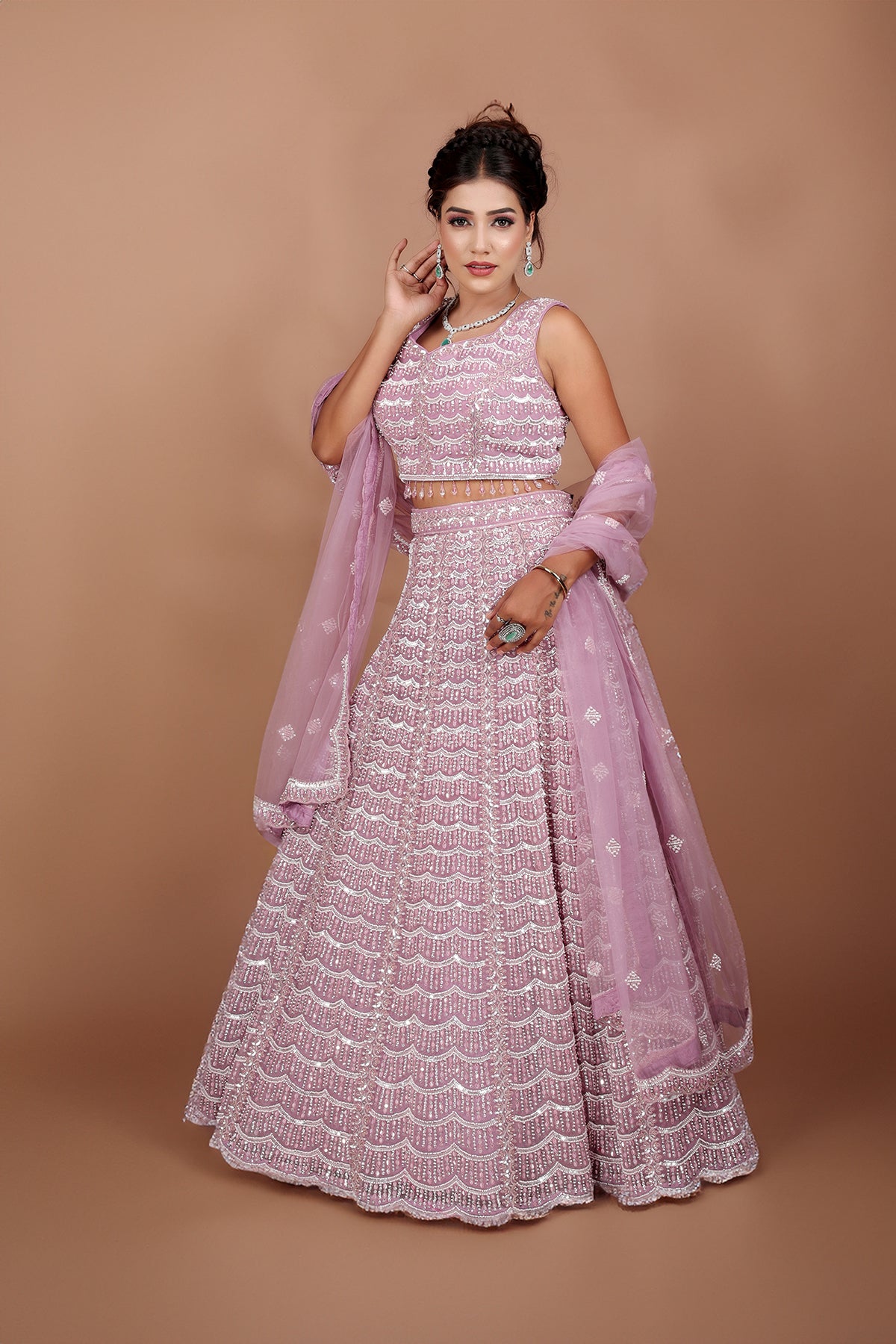 Mauve Lehenga in Net fabric adorned with thread, pearl and cut dana embroidery