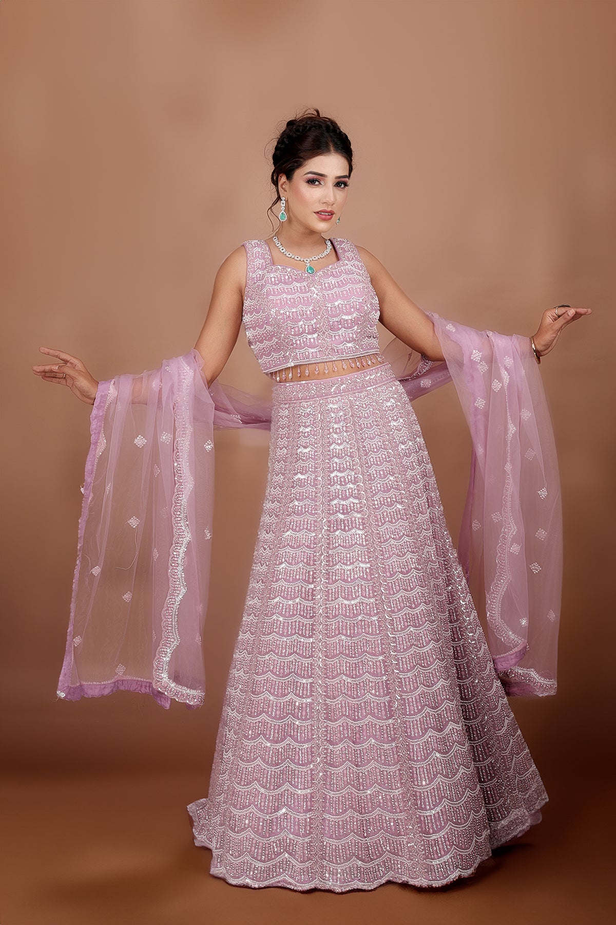 Mauve Lehenga in Net fabric adorned with thread, pearl and cut dana embroidery