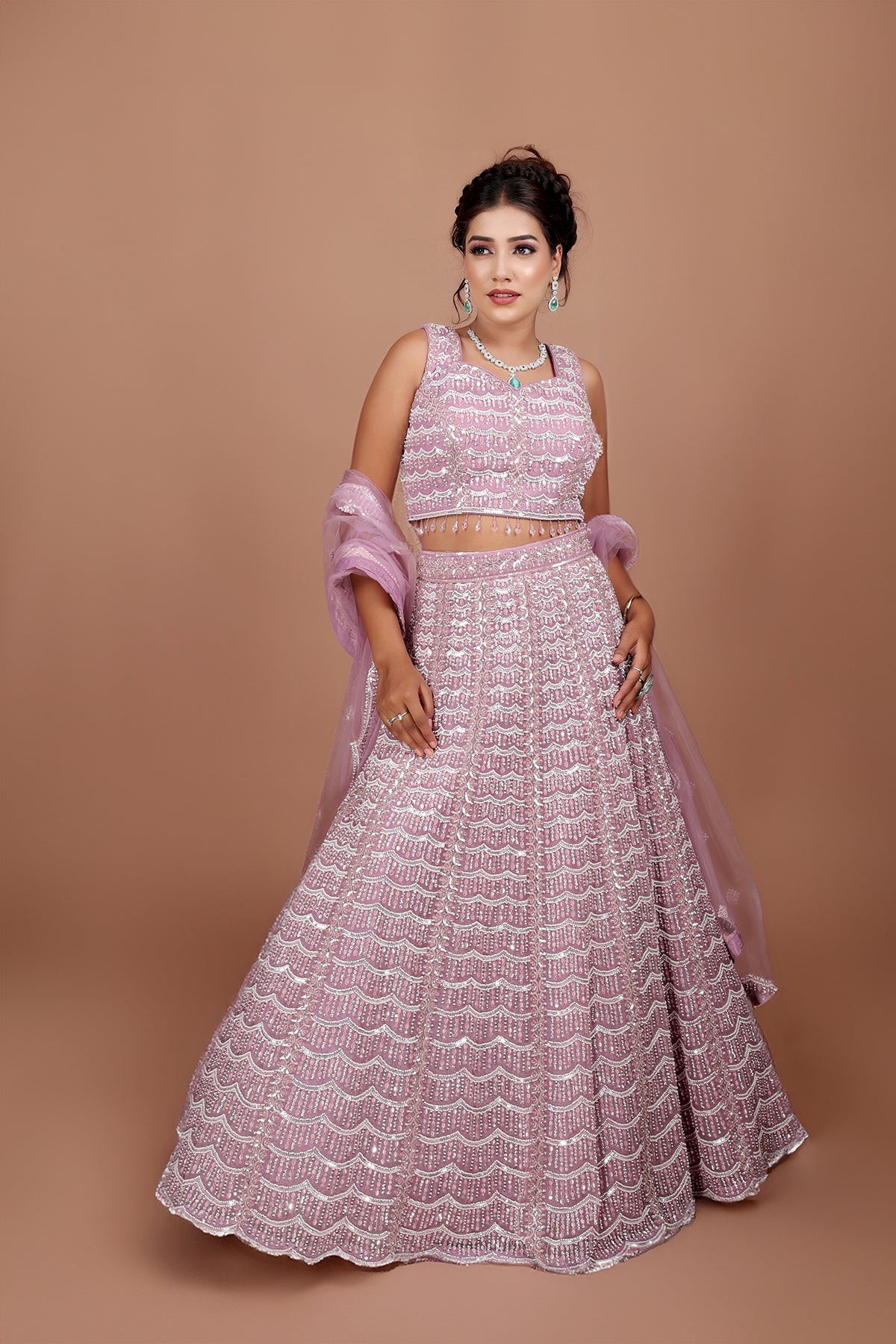 Mauve Lehenga in Net fabric adorned with thread, pearl and cut dana embroidery