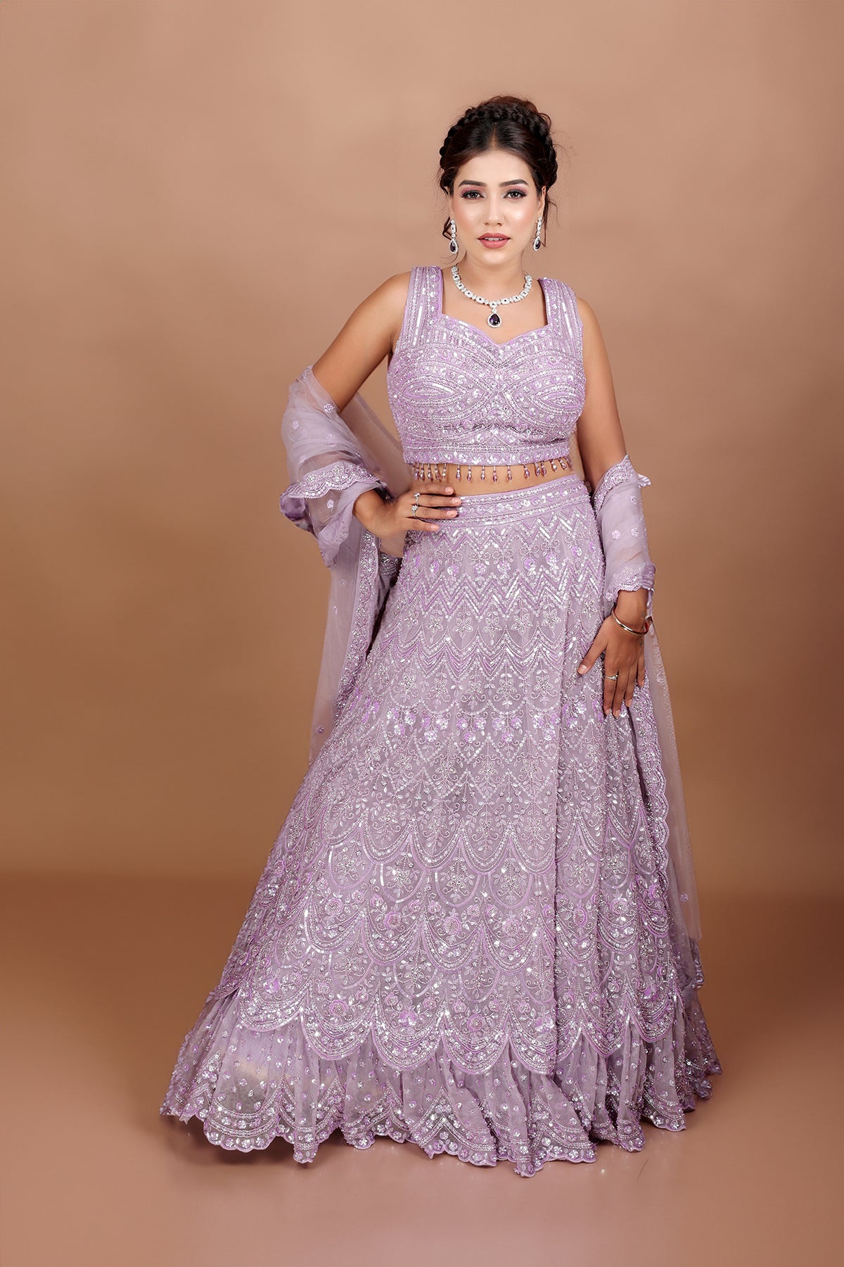 Lavender Lehenga in Net fabric adorned with thread, pearl and cut dana embroidery