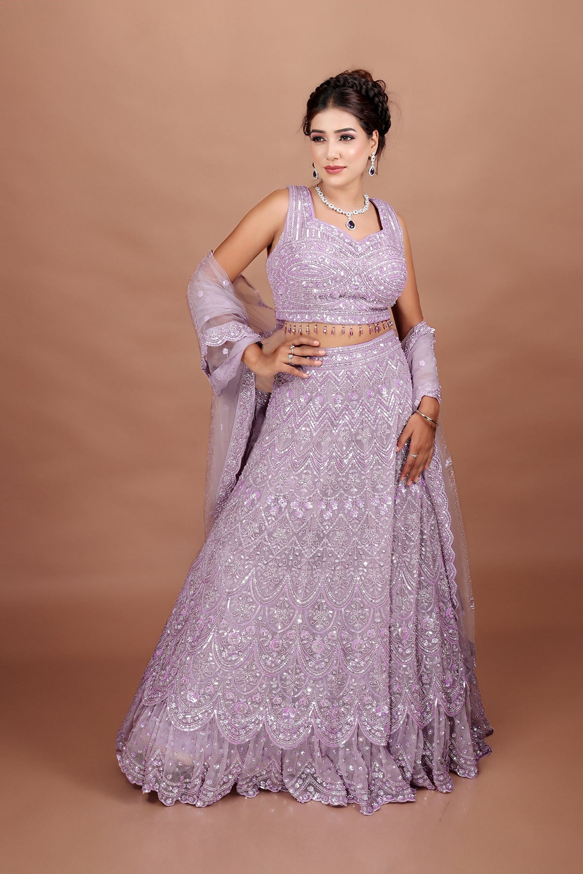 Lavender Lehenga in Net fabric adorned with thread, pearl and cut dana embroidery