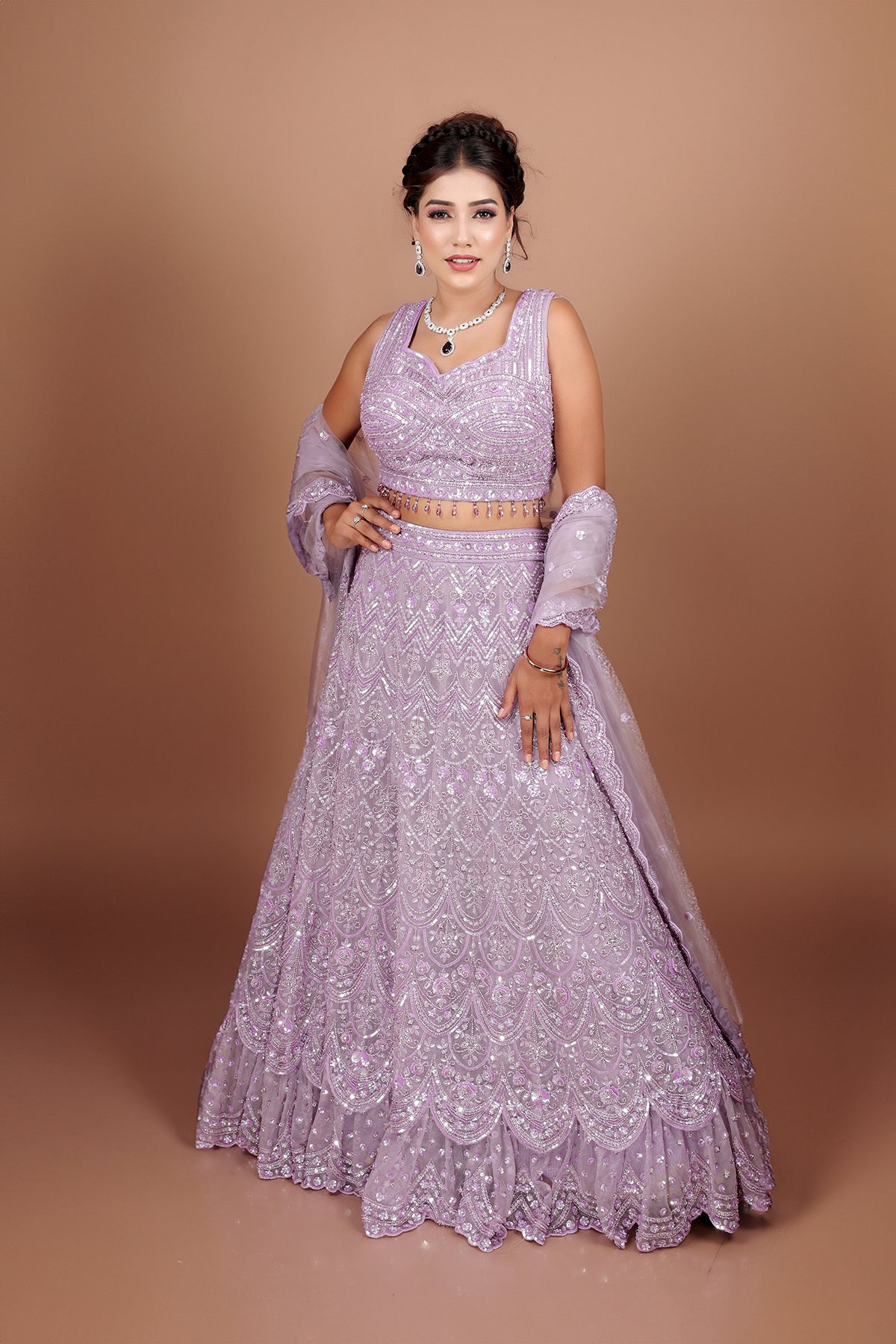 Lavender Lehenga in Net fabric adorned with thread, pearl and cut dana embroidery