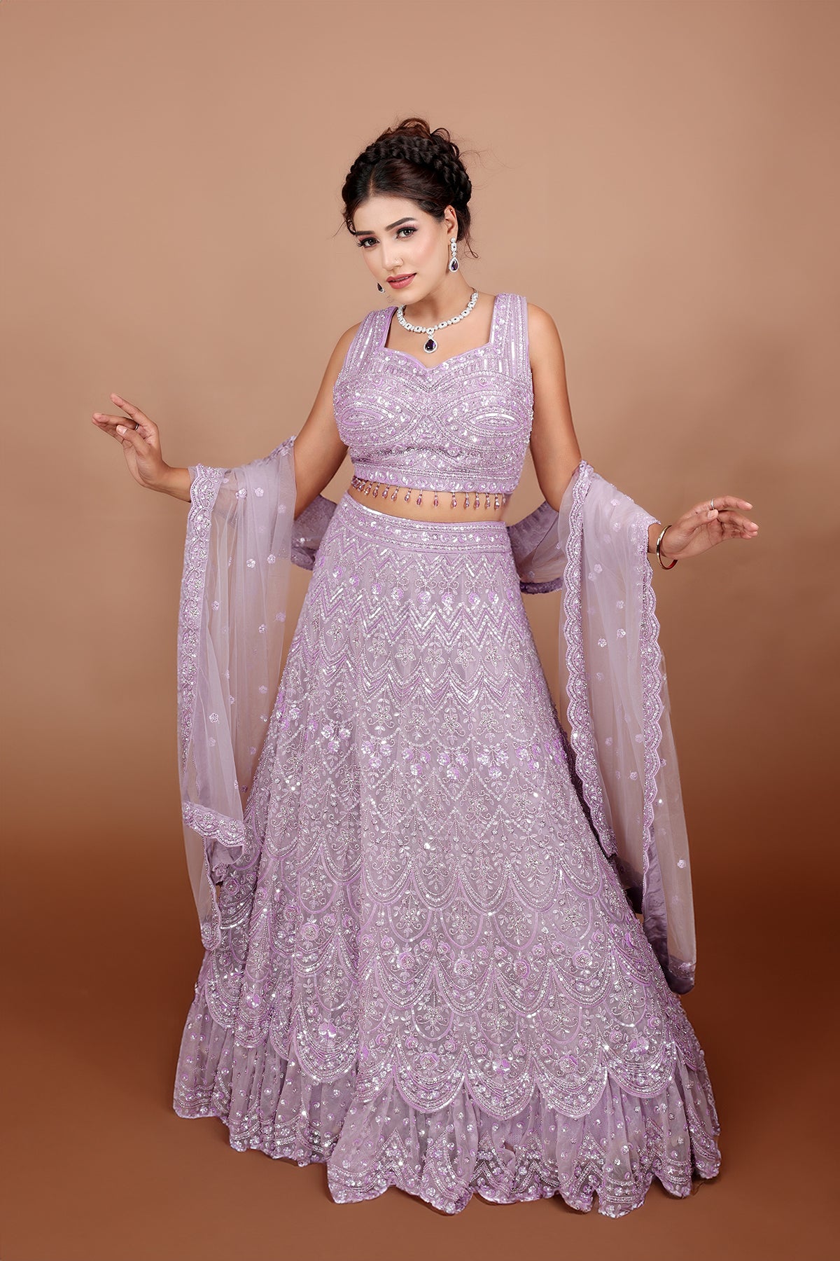 Lavender Lehenga in Net fabric adorned with thread, pearl and cut dana embroidery