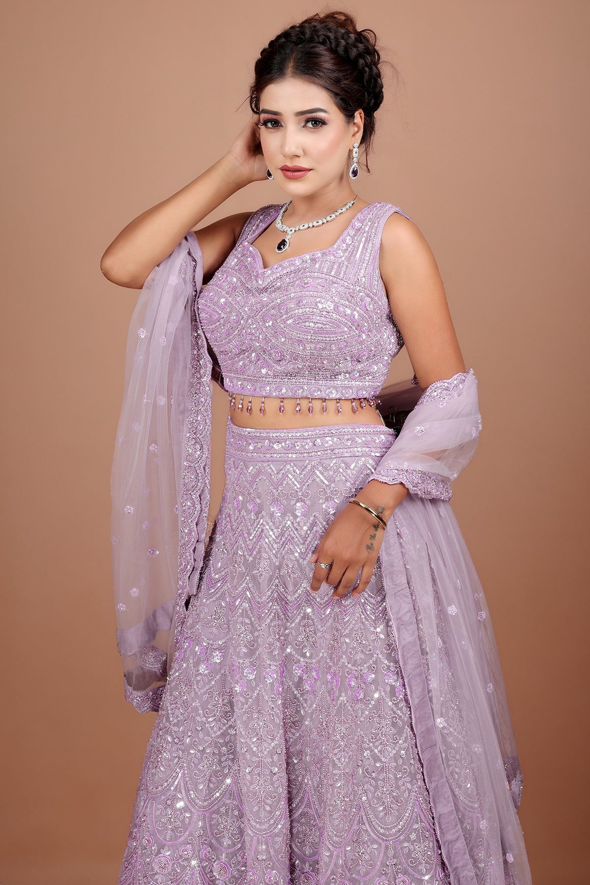 Lavender Lehenga in Net fabric adorned with thread, pearl and cut dana embroidery