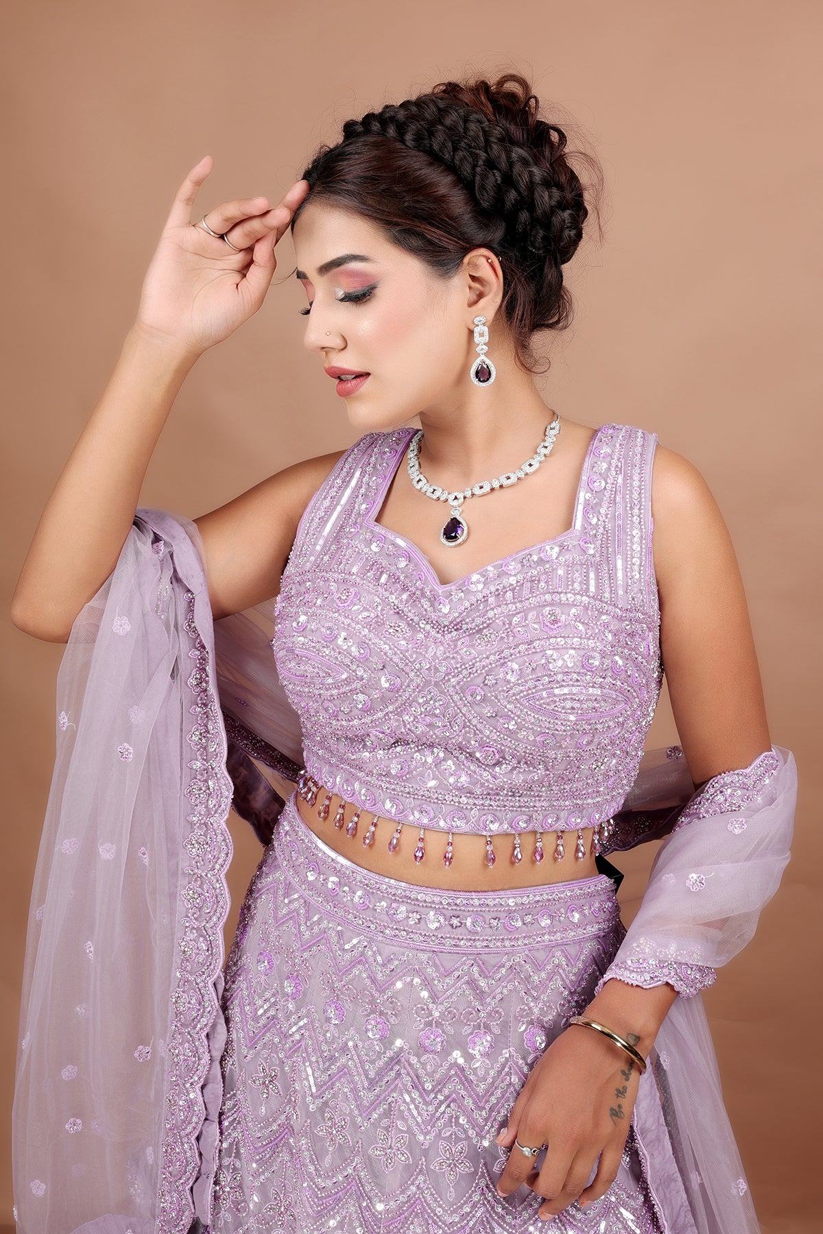 Lavender Lehenga in Net fabric adorned with thread, pearl and cut dana embroidery