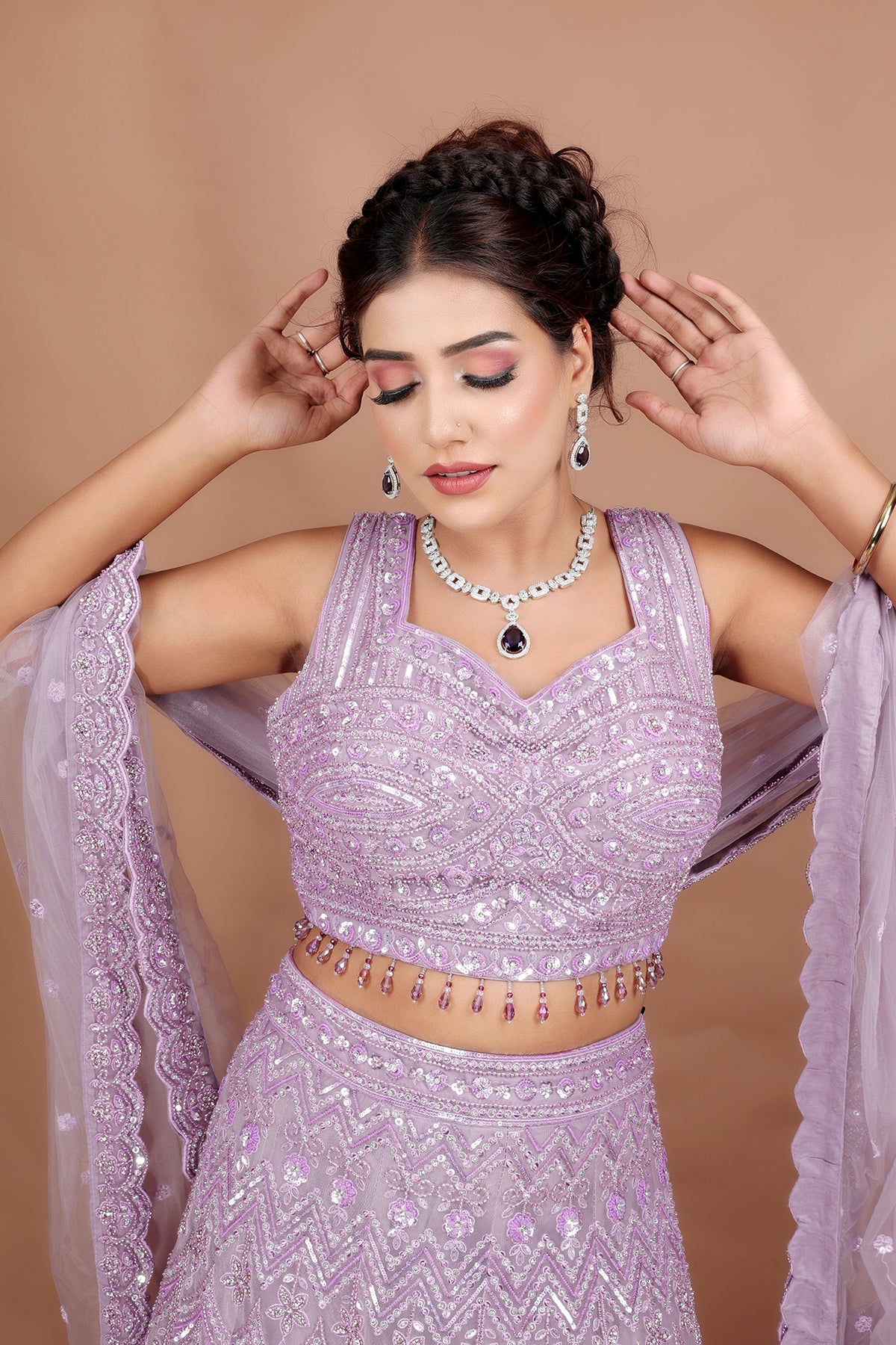 Lavender Lehenga in Net fabric adorned with thread, pearl and cut dana embroidery