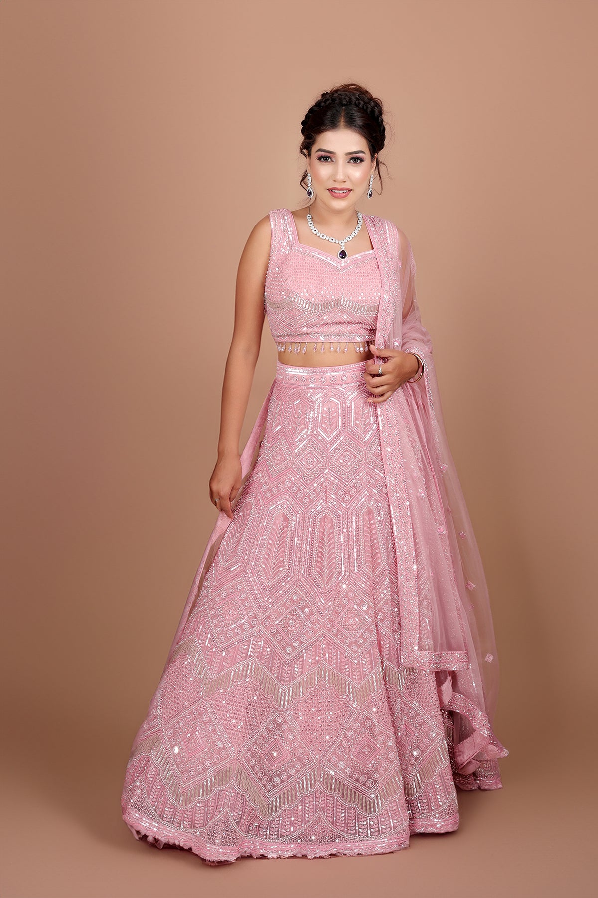 Blush pink Lehenga in Net fabric adorned with thread, pearl and cut dana embroidery