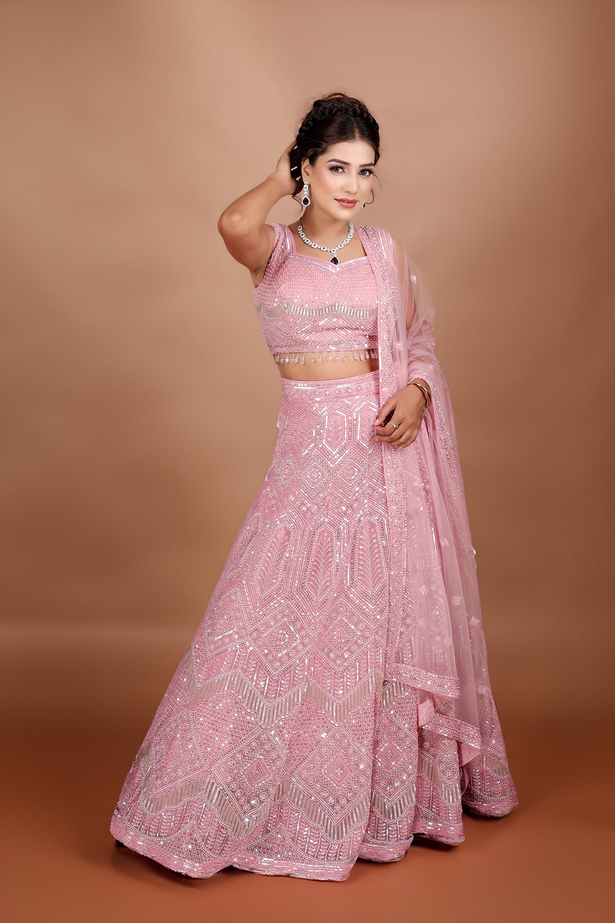 Blush pink Lehenga in Net fabric adorned with thread, pearl and cut dana embroidery