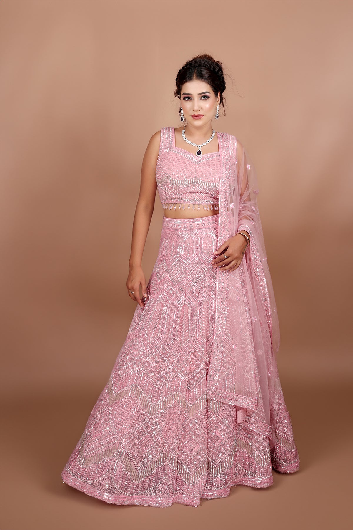 Blush pink Lehenga in Net fabric adorned with thread, pearl and cut dana embroidery