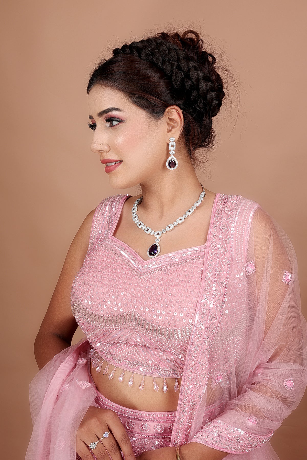 Blush pink Lehenga in Net fabric adorned with thread, pearl and cut dana embroidery