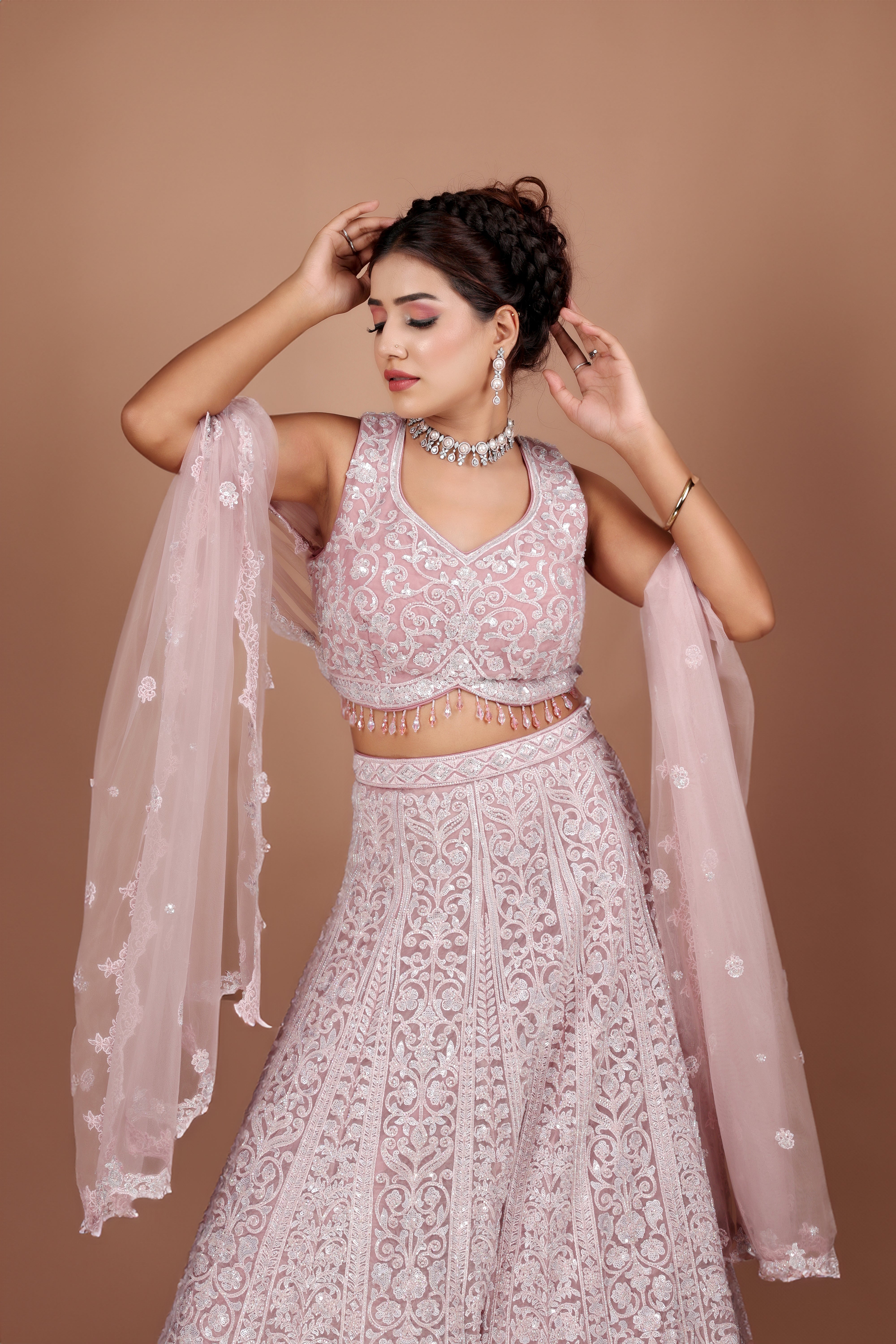 Mauve Lehenga in Net fabric adorned with thread, pearl and cut dana embroidery