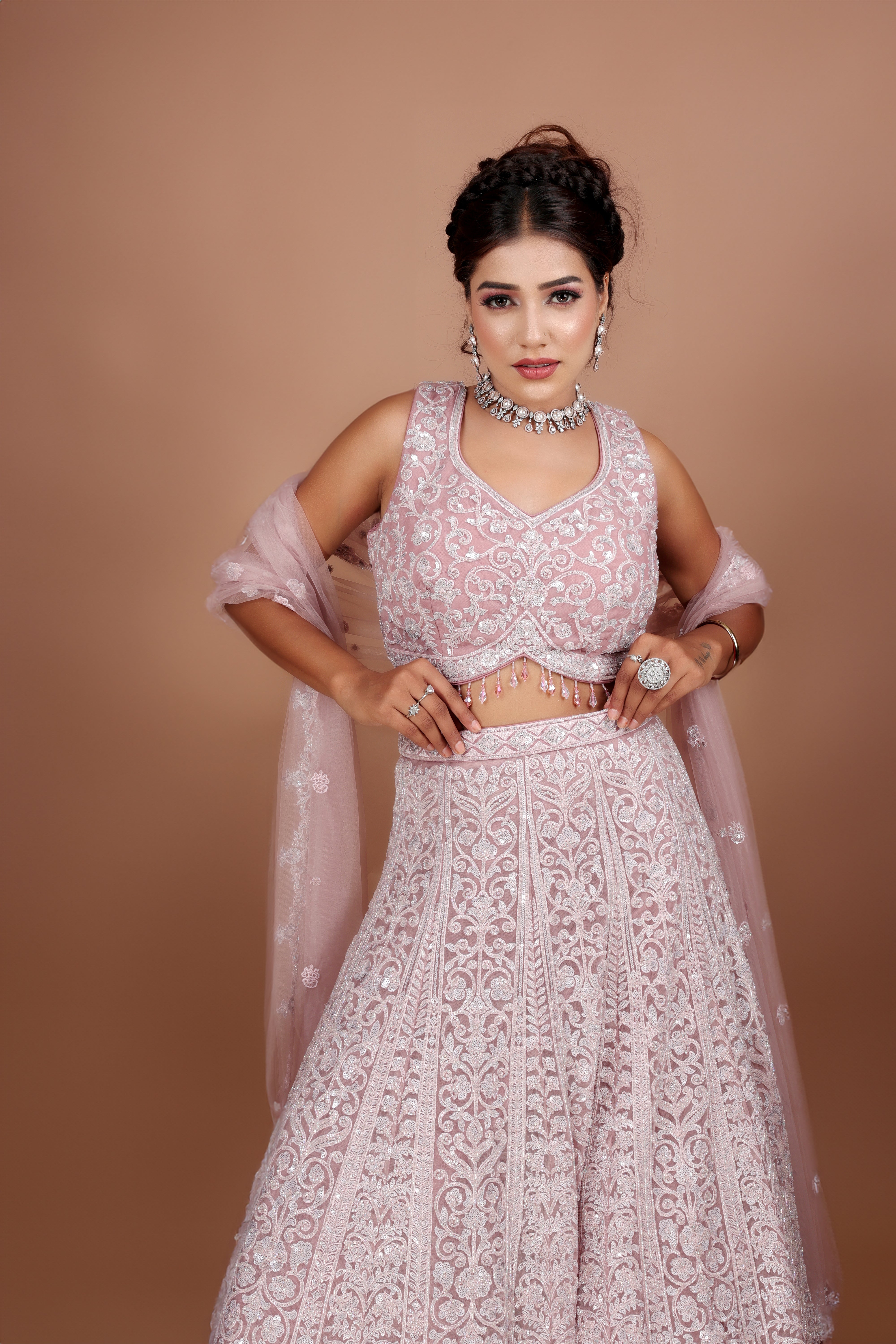 Mauve Lehenga in Net fabric adorned with thread, pearl and cut dana embroidery