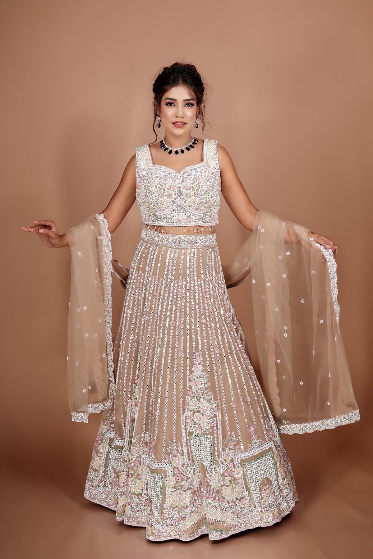 Beige Lehenga in Net fabric adorned with thread, pearl and cut dana embroidery