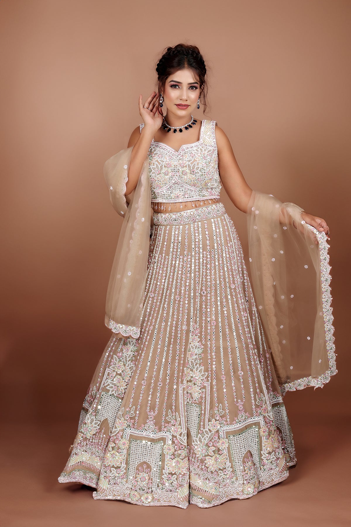 Beige Lehenga in Net fabric adorned with thread, pearl and cut dana embroidery