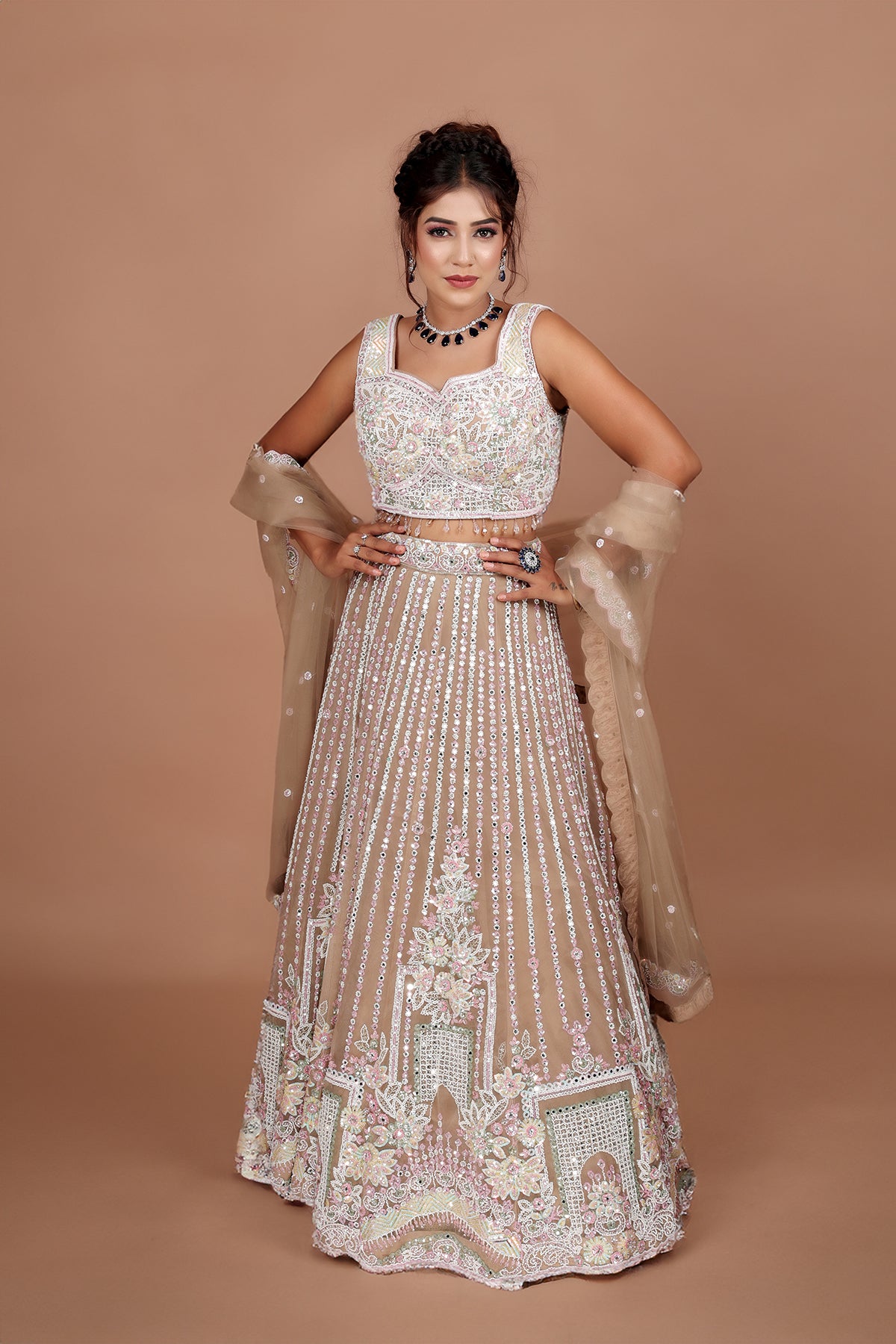 Beige Lehenga in Net fabric adorned with thread, pearl and cut dana embroidery