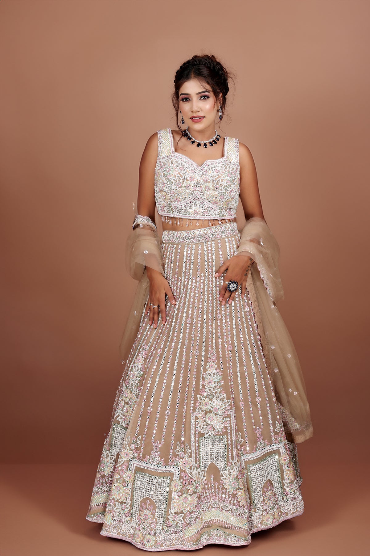 Beige Lehenga in Net fabric adorned with thread, pearl and cut dana embroidery