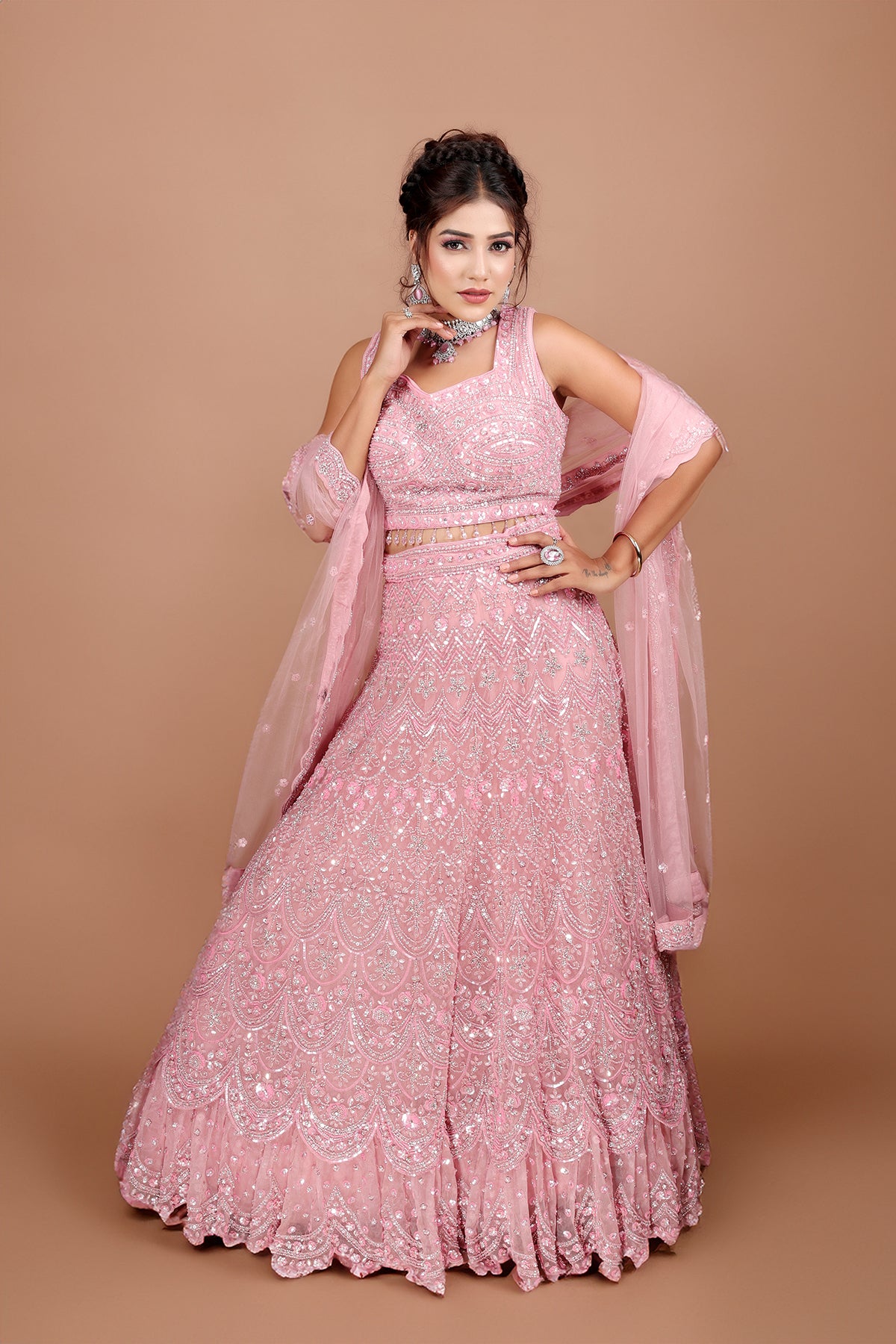 Pink Lehenga in Net fabric adorned with thread, pearl and cut dana embroidery