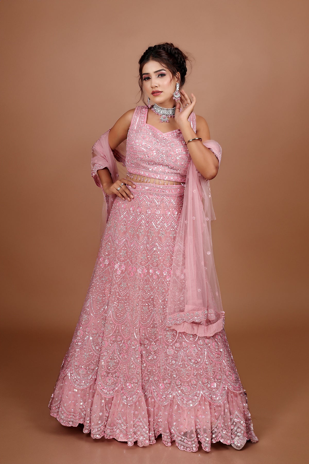 Pink Lehenga in Net fabric adorned with thread, pearl and cut dana embroidery