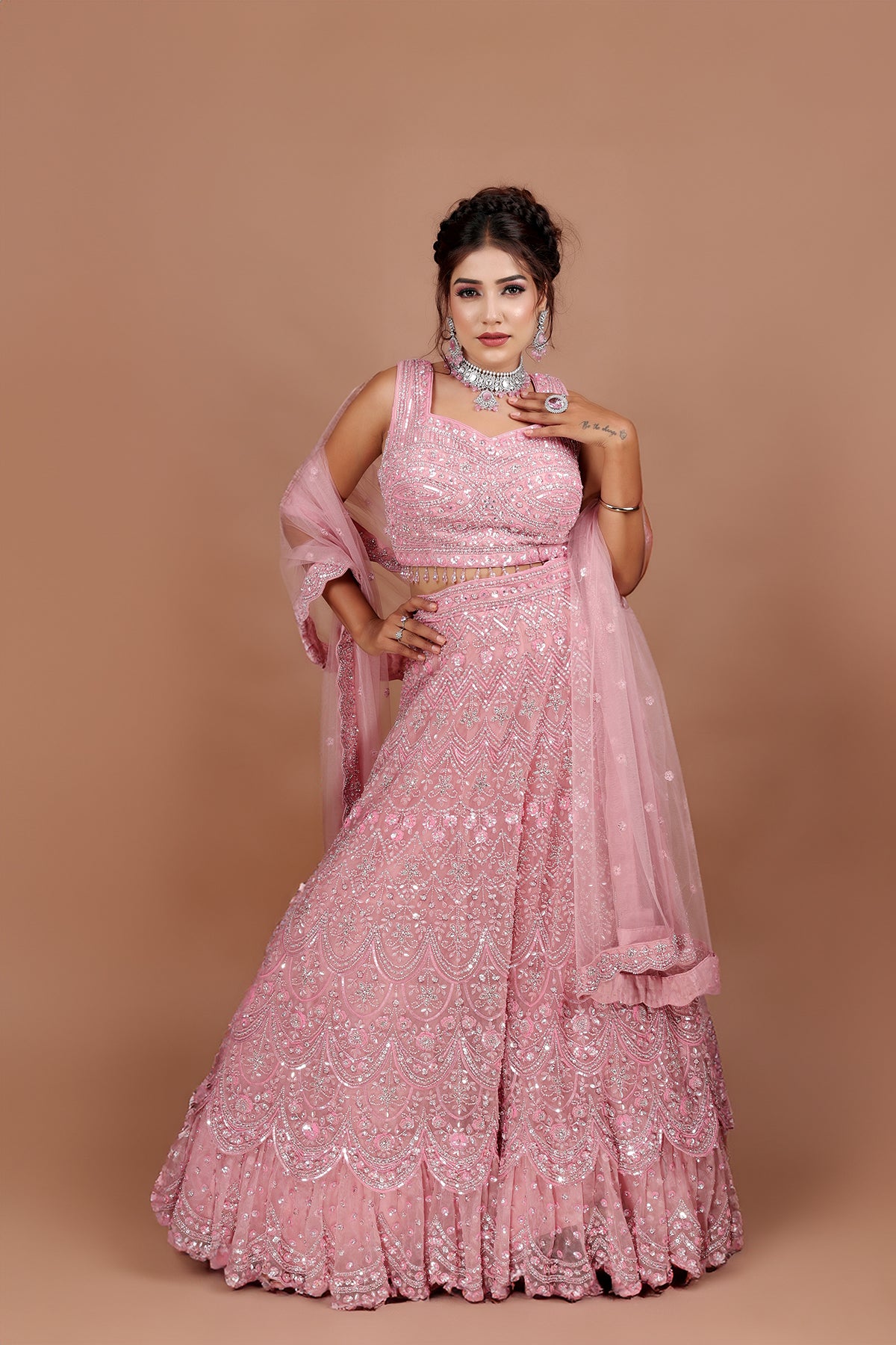 Pink Lehenga in Net fabric adorned with thread, pearl and cut dana embroidery