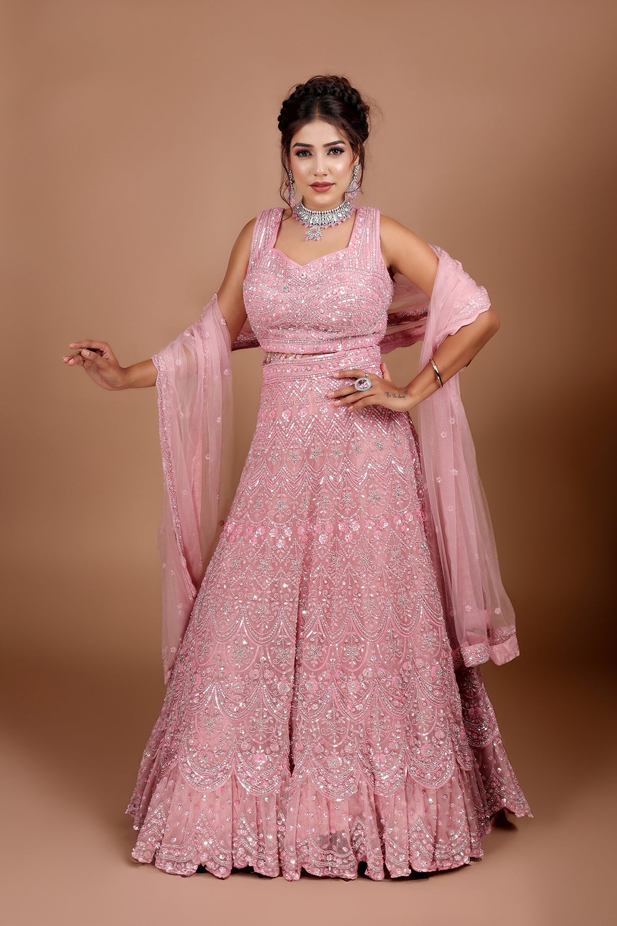 Pink Lehenga in Net fabric adorned with thread, pearl and cut dana embroidery