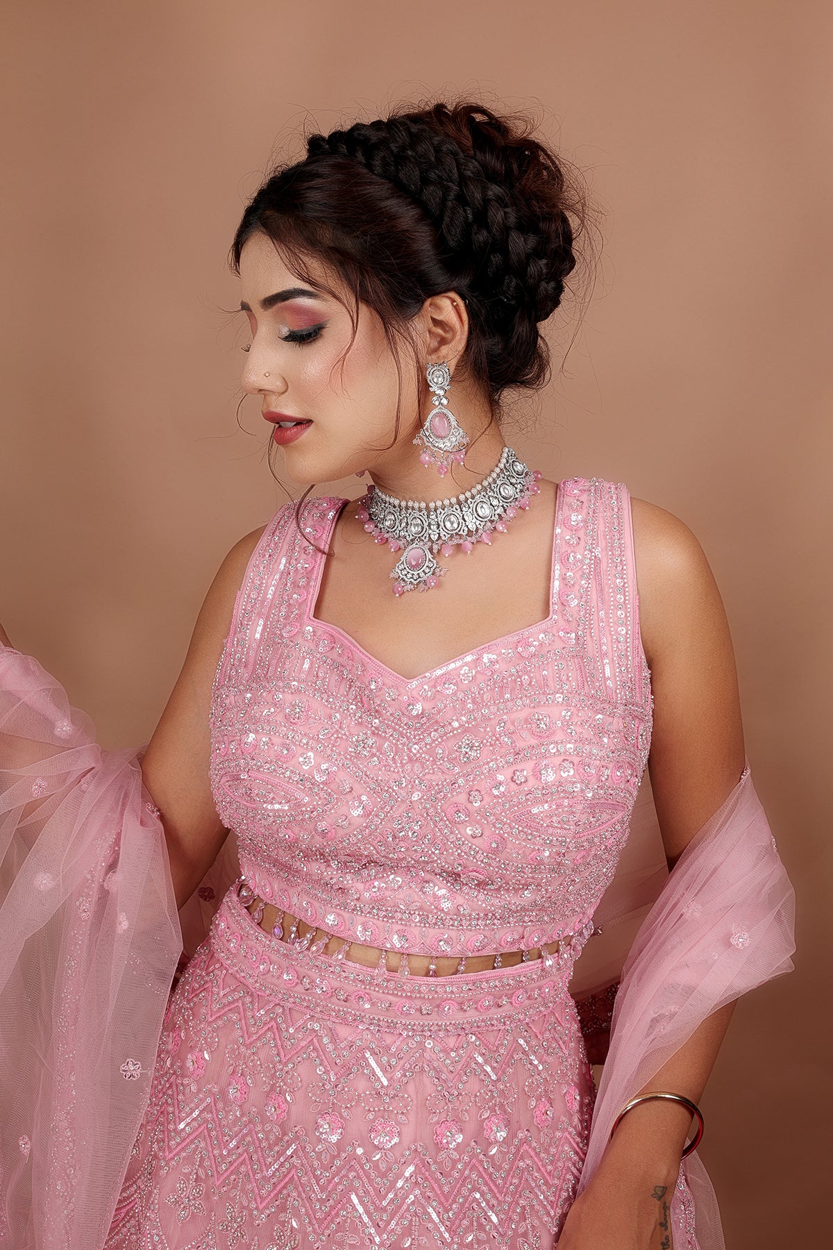 Pink Lehenga in Net fabric adorned with thread, pearl and cut dana embroidery